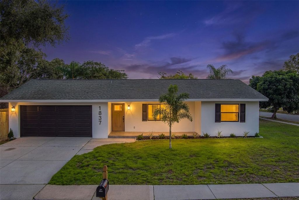 Photo of 1837 Sourwood Boulevard, Dunedin, FL 34698 (MLS # TB8458990)