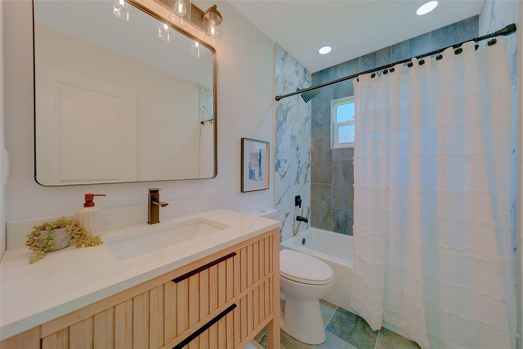 Photo of 1837 Sourwood Boulevard, Dunedin, FL 34698 (MLS # TB8458990)