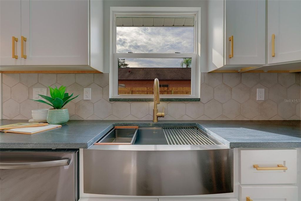 Photo of 1837 Sourwood Boulevard, Dunedin, FL 34698 (MLS # TB8458990)