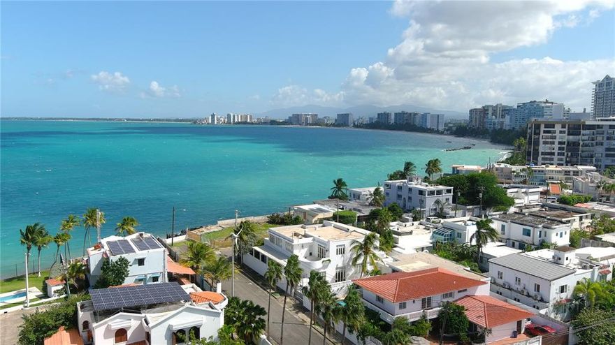 Unique once in a lifetime opportunity to have the privilege of owning one of San Juan's fewer than 70 houses that are oceanfront. Perfectly situated in one of San Juan's most exclusive 24 hour gated communities and directly in front of the ocean, this 1528sm double lot property has the most majestic coastal views imaginable. The property features two separate contiguous lots***. Delight in customizing these 2 properties and making your dream home. The first home sits on a 750sm lot boasting a beautiful colonial residence of approximately 5000sf featuring a foyer, large living and formal dining rooms, an adjacent great room with cathedral ceilings, a splendid oversize library with office and a bathroom , a huge bedroom on the first floor, a laundry room, and a maid’s room with a bath . There are three (3) additional bedrooms with gorgeous ocean views from the second story, all with baths.  The master bedroom has 2 huge walk in closets. The adjacent oceanfront home is a diamond waiting to be polished or renovated, sitting on a 778 square meter lot with 5 bedrooms. It could be used as a separate home or integrated to the previously described residence, as an additional guest house which could potentially create a unique majestic estate like no other on the limited oceanfront coast of San Juan with over 1528 square meters.  In addition both houses have solar panels on the roof. The Punta Las Marias area has long been an exclusive local neighborhood and it's living a revival as many homes are being renovated or newly constructed. It is near many restaurants, top private schools, and beautiful beaches. With the ocean right in front of your house, you have access to aquatic sports such as surfing, paddle boarding, fishing, windsurfing,swimming and a lifestyle like no other. 
***Oceanfront home 778 sm sold separately for $3.2M and contiguous residence 750sm for $3M.