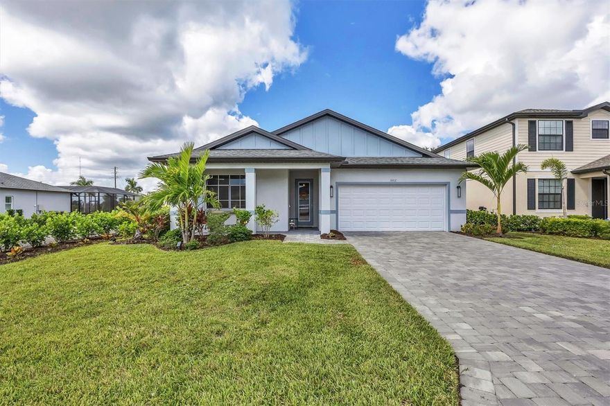 Welcome to effortless coastal living in the heart of Southwest Florida! This beautifully upgraded Palm Model by Christopher Alan Homes is move-in ready and bursting with charm. Every thoughtful detail has already been designed for you.

Walk up to a welcoming covered front porch that sets the tone for the rest of this home. Step through the glass front door into a bright and welcoming entryway that opens to a spacious living area filled with natural light from large sliders. The open layout includes a comfortable living room, a nicely sized dining area, and rattan light fixtures that bring that breezy coastal vibe together.

The kitchen is stunning, featuring a large island with rattan pendant lighting, a gorgeous tile backsplash, stainless steel appliances, and the cutest functional walk-in pantry lined with cabinetry and butcher block countertops.

Spacious guest bedrooms are perfectly split by a full bathroom with a tub/shower combo and quartz countertops. The primary suite sits privately at the back of the home and includes a large walk-in closet with custom cabinetry and drawers, plus an ensuite bath with dual quartz vanities and a spacious walk-in tile shower with a glass door.

Additional upgrades include a finished laundry room, EPOXY GARAGE FLOORS, and a screened lanai with a TV overlooking the fenced, freshly sodded yard and newly planted trees. Built with IMPACT WINDOWS AND DOORS and located in an X-FLOOD ZONE for peace of mind.

West Port offers over 450 acres of amenities, anchored by Centennial Park with a brand-new aquatic center, soccer fields, an 18-hole disc golf course, playgrounds, and miles of walking and biking trails — all with low HOA fees and just minutes to shopping, dining, healthcare, Charlotte Sports Park, and the beautiful Gulf beaches.