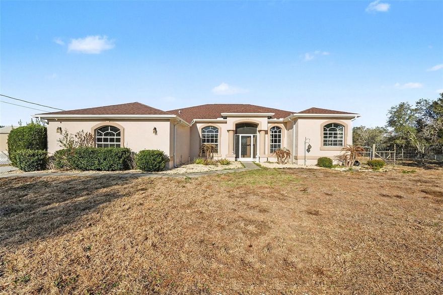 Beautiful 3BR + Office, 2BA home situated high and dry at the end of a quiet cul-de-sac on 1.2 acres (AR1 zoning) with NO HOA or CDD—bring your pets, livestock, RV, boat, or trailer! Light-filled split floor plan with high ceilings, wood-look tile flooring, and oversized sliding doors leading to a spacious screened lanai. The updated kitchen features quartz countertops, subway tile backsplash, stainless steel appliances, soft-close cabinetry, and pantry. Spacious primary suite includes French doors to lanai, walk-in closet, dual sinks, jacuzzi tub, and separate shower. Two additional bedrooms, full bath, and flexible office/den. Laundry room with cabinetry and sink. Side-entry screened garage. Property includes a custom electrified pigeon loft and a 16x20 shed with electricity—ideal for workshop or storage. Updated Roof, leach field, water softener, and shed (2021). Includes portable generator with home connection. Private, spacious, and move-in ready—schedule your showing today!