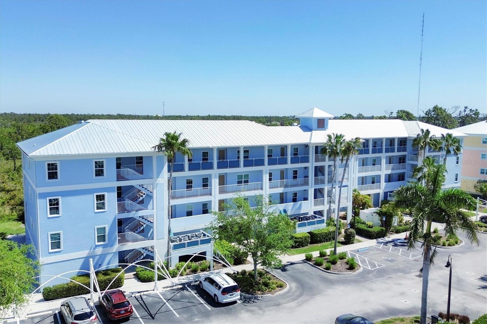 OVER $15,000.00 PRICE REDUCTION!! Welcome to your slice of paradise in this resort-style condo fully furnished located on the 4th floor, offering a serene view of the lush preserve from your screened-in porch, with a NEW ROOF and NO DAMAGE from the recent storms. Step into luxury living with an elevator granting easy access and a coveted tandem 2 CAR GARAGE equipped with a humidifier and ample storage space beneath the building. Recently repaired and adorned with fresh coastal-inspired paint, this 2-bedroom, 2-bathroom haven boasts upgraded impact windows and doors for hurricane protection, ensuring peace of mind during storm seasons. Revel in modern comforts with a new A/C, water heater, and metal roof enhancing durability and efficiency. The heart of the home is a chef's dream, featuring a stylish eat-in kitchen adorned with granite countertops, wood cabinets, and a convenient breakfast bar. Whether preparing meals or entertaining guests, the kitchen seamlessly flows into the spacious living and dining area, all offering breathtaking views of the natural surroundings from the screened porch. Retreat to the primary bedroom oasis complete with a walk-in closet and an ensuite bath featuring granite countertops, and newly tiled shower. The generously sized guest room is situated adjacent to the guest bath, ensuring comfort and privacy for family or visitors. Indulge in the unparalleled amenities of the resort-style community, including a heated pool, spa, clubhouse, fitness center, putting green, and courts for pickleball, tennis, and basketball. Explore nearby attractions such as Boca Grande, Don Pedro Island, and Englewood Beach, while marinas, shopping, dining, golfing, boating, fishing, and entertainment are all within easy reach. Embrace an active lifestyle with daily walks along the community sidewalks, knowing you've found the perfect blend of luxury, convenience, and leisure in this coastal gem.