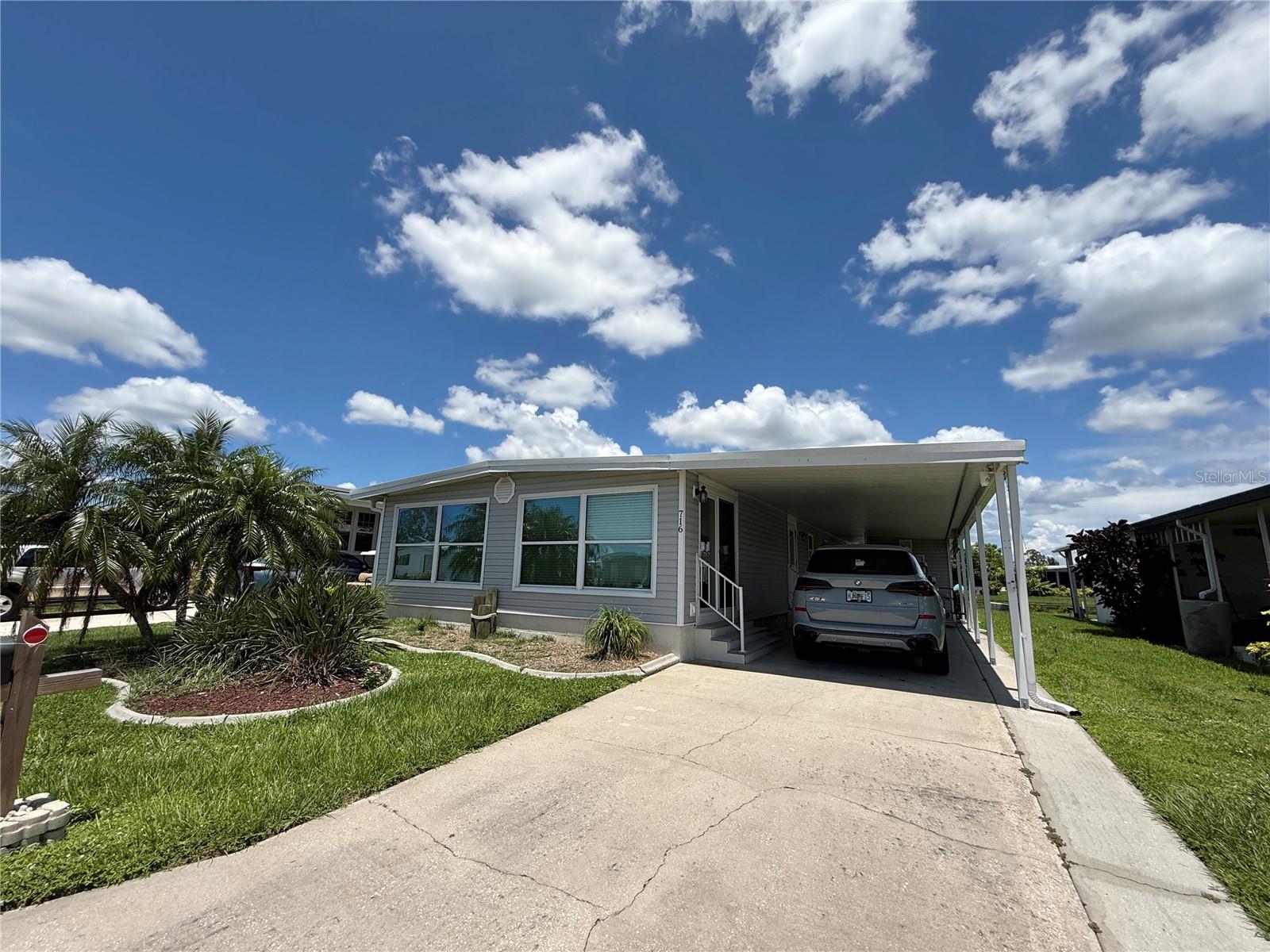 Waterfront Living at Its Best – Updated 2BR + 2 Den/office with Dock in Amenity-Rich 55+ Harbor Cove Community
Welcome to Harbor Cove, an award-winning 55+ waterfront community nestled along the scenic Myakka River, where every day feels like a vacation. This beautifully updated 2-bedroom, 2-bath + den canal-front home is fully furnished and move-in ready, offering direct Gulf-access boating right from your private dock—a rare opportunity at an unbeatable value.
Step into a sun-filled open-concept layout that blends comfort and functionality. The kitchen is equipped with attractive countertops, a center island with slide-out drawers for extra prep space, and a cozy dining nook—perfect for morning coffee or evening meals. The spacious living room flows seamlessly into the remodeled Florida room (an additional 220 sq ft of living space), boasting expansive windows that capture tranquil views of the water.
Enjoy peaceful mornings in the primary bedroom with ensuite bath and serene canal views, while a flexible bonus room offers ideal space for a home office, craft room, or guest suite. The second bedroom and guest bath are thoughtfully designed with wide doorways for enhanced accessibility.
Outside, relax or entertain on your private patio after a day on the water. The covered carport accommodates multiple vehicles, and a 15' x 8' storage/laundry shed keeps everything organized. Major recent upgrades include a new A/C system and washer/dryer (2024), roof, ceilings, and lighting (2023), and updated electrical (2022). A golf cart is also included!
For just $150/month HOA, enjoy full access to an impressive list of amenities:
2 heated pools & hot tubs.
90-slip marina with dry storage.
Fitness & recreation center.
Tennis, bocce, shuffleboard, pickleball, horseshoes.
Art & fitness classes, dances, bingo, woodworking, boat & bowling clubs, and more.
Harbor Cove has been voted the area's Best Manufactured Home Community 8 times and is located minutes from Downtown Wellen Park, Costco, shopping, dining, and the white-sand Gulf beaches.
Whether you're a boater, nature lover, or social butterfly, this canal-front gem offers the lifestyle you’ve been dreaming of. Live your vacation—every day. Schedule your showing today! 12% tax apply for all rentals 6 months or less.