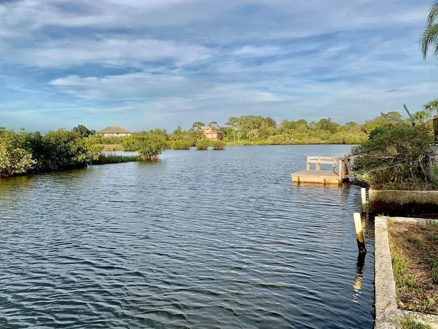This waterfront lot in Driftwood Isles offers the perfect setting to build your dream home. With 67 feet of canal-frontage and a private boat ramp, you'll enjoy immediate access to the water and endless opportunities for fishing, boating, and relaxation. Imagine watching dolphins and manatees glide by from your own backyard, or unwinding with breathtaking sunsets over the Gulf of Mexico. Located just minutes from popular local spots like Inn on the Gulf and Sam's Beach Bar, this property combines tranquility with convenient access to amenities. Don't miss this incredible opportunity to own a piece of waterfront paradise.
