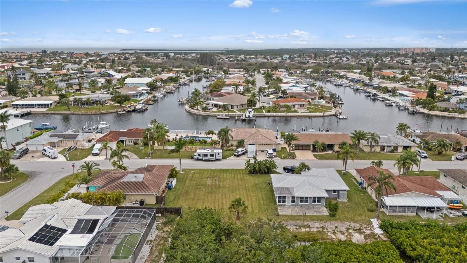 Stunning Waterfront Property – A Blank Canvas for Your Dream Retreat!
This exceptional waterfront lot offers endless possibilities for those seeking a peaceful and private retreat, or an opportunity to create their dream home. Nestled along serene waters, this property boasts breathtaking views & tranquil surroundings. Enjoy the Yacht Club, Marina, Civic Center Events AND The private beach club that is exclusively for Gulf Harbor residents only!
With 5,270 sq ft of untouched land, you’ll have plenty of space to craft a custom waterfront haven. All services are available at the road, land has been surveyed and tested. Setbacks have been set for the build. All documents attached. Whether you envision a cozy getaway cabin, an outdoor enthusiast's paradise, or a luxurious estate, this lot is the perfect setting for it all. Surrounded by lush greenery and scenic landscapes, the property provides both seclusion and convenience with nearby amenities, such as shops, supermarkets, schools, and Downtown!
This rare gem is a true escape from the hustle and bustle, while still within reach of Trinity and New Port Richey shopping and events. Don’t miss your chance to own this prime piece of waterfront paradise—schedule a viewing today!