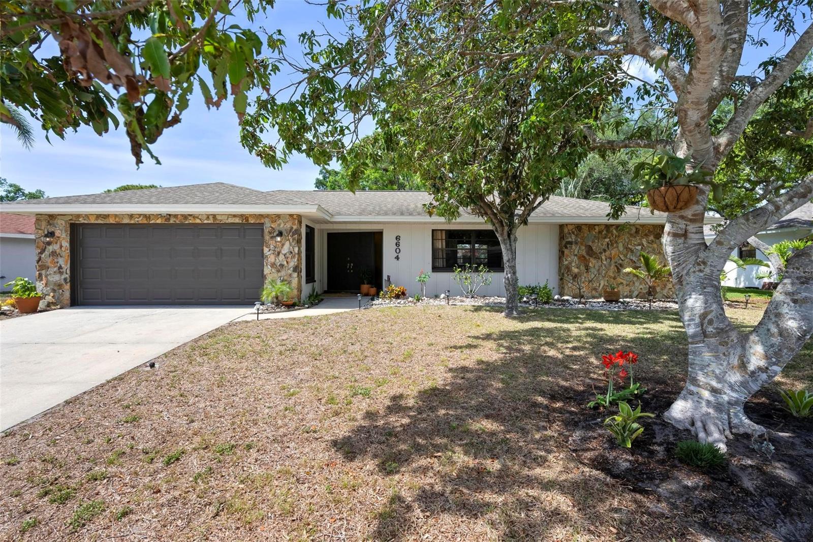 Spacious Pool Home in Desirable Pointe West - A True Florida Gem! Discover this beautifully maintained block ranch home in the sought-after Pointe West neighborhood, offering a split floor plan and a large private pool-all just 15 minutes from the beaches! Nestled in a tranquil, high-elevation community, this home provides the perfect blend of comfort, functionality, and Florida living. The private master suite occupies the east wing of the home, featuring a walk-in closet, ensuite bath with a walk-in shower, and sliding doors leading to the fully fenced backyard and pool deck. Adjacent to the master suite, a formal living room provides a peaceful retreat. On the west side, the family and social room boasts a stunning stone wood-burning fireplace and is conveniently situated near two guest bedrooms that share a second full bath. At the heart of the home, the central kitchen offers ample prep space and a convenient pass-through window to the patio-perfect for alfresco dining. The expansive living and dining areas provide generous space for both entertaining and everyday family life. Three sets of sliding doors seamlessly connect indoor and outdoor spaces, enhancing the home's natural flow. Step outside to your screened-in lanai and vaulted pool cage, overlooking a fully fenced, private backyard serene setting for both relaxation and recreation. The oversized pavered pool deck surrounds a large swimming pool, ideal for entertaining family and friends. Multiple seating areas provide flexibility for lounging, dining, or soaking in the Florida sunshine. Recent improvements-HVAC System (2021), Tile Flooring Throughout (2019), Pavered Pool Deck (2015), Pool Resurfacing (2015),New Pool Pump (2024), Freshly Painted Interior & Exterior (2024). Pointe West offers unparalleled convenience, just minutes from Anna Maria Island, top-rated beaches, shopping, dining, and medical facilities. Nature enthusiasts will love nearby Robinson Preserve, Desoto National Park, Palma Sola Bay, and G.T. Bray Park. The home is also close to IMG Academy, Cortez Fishing Village, and local boat ramps. Whether you're looking for a primary residence, vacation home, or investment property, this home delivers the best of Florida's coastal lifestyle. Furniture available for purchase separately. Schedule your private tour today!