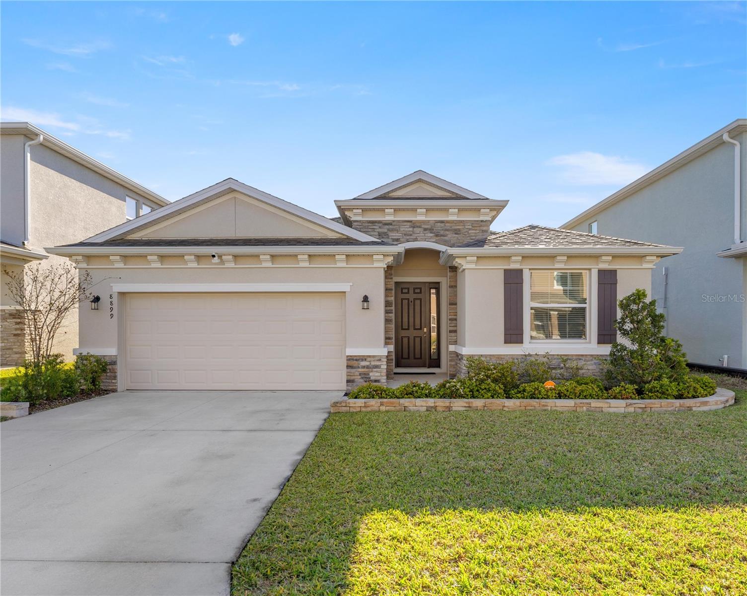Spacious 4 bedroom, 2.5 bath home located in a gated community near SR 200, main roads, and schools. Home features tile flooring throughout with carpet in the bedrooms, inside laundry, and a fenced yard. Enjoy the nicely landscaped yard, a paved pad perfect for BBQs, and a screened porch for relaxing. Convenient location with community security and easy access to shopping and dining.