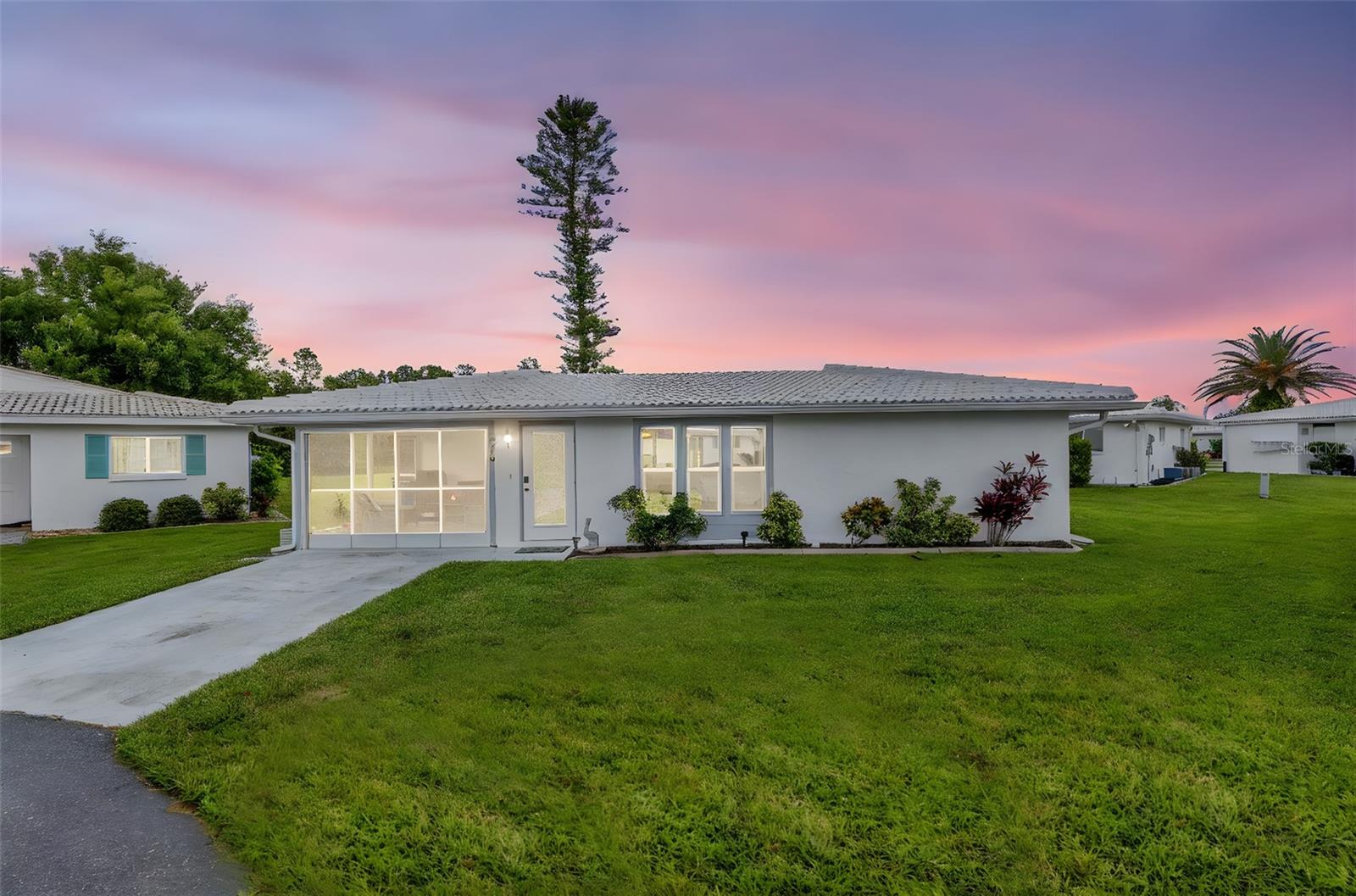 You must see this TRANSFORMATION where Comfort meets Style to appreciate making this the home that you have dreamed of. This sought after community of Circle Woods provides a serene & private setting that's unique. This OPEN FLOOR plan will impress you with how much livable space has been utilized!. This home beckons you to entertain your family & friends. This designer kitchen featuring all new STAINLESS STEEL appliances set off by GORGEOUS QUARTZ COUNTERTOPS & a breakfast bar that will seat up to 5. Directly across is your wet bar with a lg wine cooler & a hide away sink, a large pantry, additional cabinets & additional counter space. The flooring is a Luxury Vinyl that not only is beautiful but durable & easy to care for. They have thought of everything to make this stand above the rest. But don't stop there, we have a NEW TILE ROOF, IMPACT RESISTANT WINDOWS & DOORS,TANKLESS HOT WATER HEATER & a new ELECTRIC PANEL has been installed. The HVAC IS 2014. The Primary bedroom en-suite has a walk in closet & fully renovated private bath with a walk in shower that is equipped with a Bluetooth Speaker to enjoy your tunes while you shower and there's even a seat and built-ins for your shampoos and soaps The split floor plan gives overnight guest the privacy you all appreciate. The guest bedroom boast 3 closets & 1 is a large walk in. It's hard to find a unit that has this amount of storage space. This carport was converted into a screened lanai for enjoying the outdoor FLORIDA LIFESTYLE. It has the flexibility to be opened up in the front so you can drive your vehicle in there when you are away for an extended time. Unit R-3 is in the back part of the community so you have the benefit of a lush green backdrop to enjoy. If you want to consider a patio out the back, the community guidelines can help with that. You have a large indoor laundry room with additional storage. Circle Woods is located close to everything, Venice and Englewood are practically right outside your door where you can enjoy First Class Restaurants, Shops, live entertainment, local eateries and a wealth of outdoor activities. Enjoy the pristine miles of coastal beaches. Venice Beach and Manasota Key are close proximity to Circle Woods. Downtown Venice has a special vibe all it's own. You won't want to miss out on our concerts in the park, the Farmers Market on Saturday mornings, or our classic theater performances and The Venice Institute for Performing Arts Center where they hold educational programs and First-class entertainment, 3 libraries in the areas, hospitals and close to Airports! Wellen Park is in close proximity to Circle Woods and the Cool Today Park is where the Atlanta Braces come for their Spring Training, so there is always something going on. Best of all we have miles of beautiful beaches and breath taking sunsets, and to have your community right in the heart of it all...! The community offers the ultimate in stress-free Florida living. Residents also enjoy a social calendar with yearly events. There is always activities you can join in. Check out the Clubhouse, Game Room, Gym, Library, 2 Heated Pools and a Spa. We have shuffleboard, Bocce ball. Start your new adventure and experiencing the best of Florida’s Gulf Coast lifestyle in Paradise. Furniture is negotiable. Owners may rent after owning their home for 2 years with a minimum of 3 months and a total of 2 leases /year. You are allowed a dog or cat. Schedule your showing today.