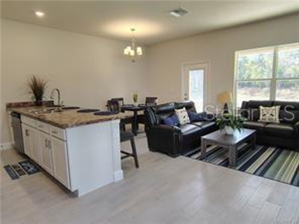 Photo of 235 Bittern Loop, Inverness, FL 34453 (MLS # OM722177)