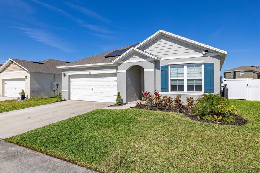 Beautifully upgraded single family home at Kindred in Kissimmee. This lovely home features 3 bedrooms and 2 baths with a 2 car garage without carpet. The home inside carries the grey tones throughout the home with modern door trims and baseboards. The secondary bedrooms sit in the front of the home with a bathroom in between. The bathroom features granite countertops. The kitchen are is an open concept overlooking the living room and dining room areas. The kitchen features granite countertops, white shaker cabinets, stainless steel appliances and a large pantry closet. (Pictured refrigerator will be replaced for another one). Dining room has shiplap wall paneling in the dining area and feature wall with wood panel on the TV wall. Large master bedroom with paneling wall on the sides. Master bath has dual sinks, granite countertop, large linen closet and walk in shower. Exterior is fully fenced and features a covered patio. Come see it before its gone!