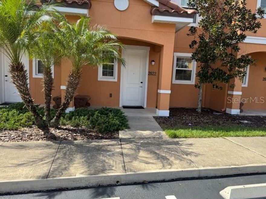 Stunning upgraded deluxe townhome in the very popular gated community of Regal Oaks at Old Town. Ideally located adjacent to Old Town and a ten minute drive to Walt Disney World Resort.  Enjoy a very open floor plan featuring access to the oversized screened lanai with heated hot tub and views to the tranquil water feature.  First floor laundry and powder room.  Primary bedroom with ensuite bath and guest room with ensuite bath on second floor.  Ceramic tile on main floor and luxury vinyl planks on stairs and in bedrooms.  State of the art Clubhouse with resort style pool, cabanas, water slide and pool bar and snack bar.  Clubhouse also features restaurant, lounge, fitness center, games room, convenience store and tennis court.  A perfect oasis for rental guests, owners use or a combination of both.  Professional interior, exterior and aerial photos to follow.  Please check back.