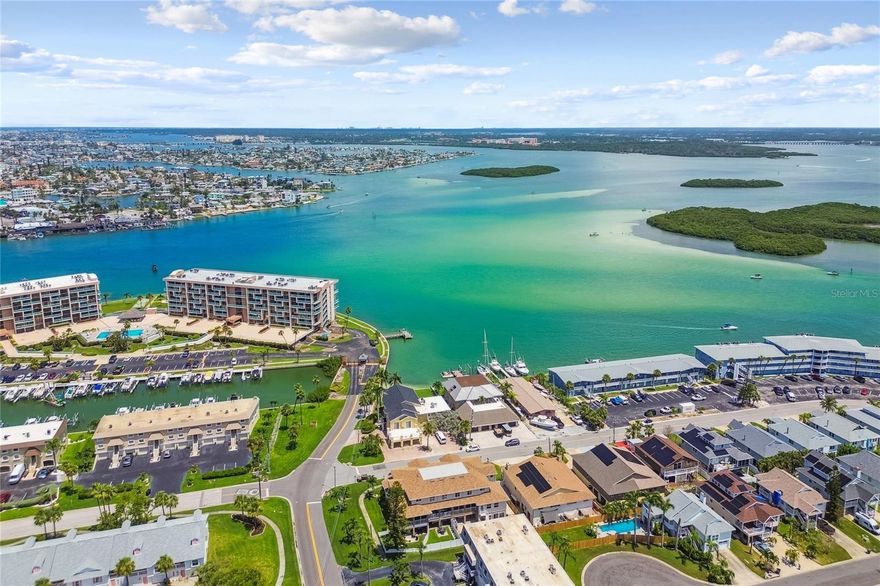 Move right into this stunning updated 3 Bedroom, 2 1/2 Bathroom, Beachside Townhome with Stunning Views of John's Pass and the Intracoastal Waterways. Tucked deep on the Exclusive Island enclave of Isle of Capri in beautiful Treasure Island, Capri Gulfgate Townhomes is an Intimate 4-Unit Association closely managed and maintained with pride. Providing a true residential feel with incredible access to Treasure Island, Madeira Beach, and Saint Pete Beach, your own special Island Lifestyle and Beach Lifestyle balances exceptionally with all the amenities that the Greater St. Petersburg Area has to offer. Hop on your Golf Cart or Bicycle and catch World-Famous Nightly Sunsets from atop the John's Pass Bridge, or along the nearly 1-Mile Treasure Island Beachfront Trail. Be sure to stop in VIP for incredible Mexican or Middle Grounds for Elevated Marine Fare and Exceptional Steaks. The Spacious 2+ Car Tandem Garage offering additional storage space for kayaks, paddleboards, bicycles, and even a golf cart, is light and bright, finished with Durable Epoxy Flooring. The Open Living Area provides an Inviting Space to Gather or Unwind after a long day of getting your toes wet on the White Sand Beaches along the Gulf. With several Screened Balconies, you'll find enjoying the Fresh Florida Air is just a step in any direction. The Modern Kitchen is a Chef's Dream, offering stunning Dual-Toned Wood Shaker-Style Cabinets and Soft-Close Drawers. Complete with Samsung 22 cu. ft. Counter Depth Side-by-Side Refrigerator with Touch Screen Family Hub™ in Black Stainless Steel, Samsung Flex Duo 30-in Glass Top 5 burners 3.4-cu ft / 2.7-cu ft Air Fry Convection Oven Freestanding Double Oven Electric Range, compatible with SmartThings, and Over-the-Range Microwave, the Kitchen blends Sleek Aesthetics and Modern Amenities with Flawless Functionality. Step onto the balcony of the Primary Bedroom for Stunning Summer Sunsets and peeks of the glistening Intracoastal Waterway and John's Pass Sandbar. Offering a Walk-In Closet and En Suite Bath, complete with separate shower and jacuzzi-style tub, the Primary Bedroom is a Spacious Oasis perfect for a long night's rest, or peacefully relaxing the day away. With two additional guest beds and an Abundance of Storage, the upstairs sleeping quarters provides plenty of space for everyone to spread out. The Air-Conditioned Inside Laundry Room is located on the same level as the Bedrooms, offering convenience and comfort for the new homeowner. With quick access to I-275 and short rides to Tampa International Airport and St Petersburg/Clearwater International Airport, weekend getaways and work trips could not be easier. But why leave when you are surrounded in all directions by some of the most pristine beaches in the entire world available in all directions: Treasure Island, Indian Rocks Beach, Clearwater Beach, Madeira Beach, Saint Pete Beach, and Fort DeSoto Beach make great destinations for all of your guests! The location is UNBEATABLE! Downtown St Pete is about 20 minutes away offering world class dining, shopping, and culture. With a large corporate presence within minutes of Capri Isle, you'll find relocating for work easier than ever: Jabil, TechData, HSN, Franklin Templeton, Raymond James, Bankers, Progressive, FIS, and the Carillon corporate hub are all within a few minutes' drive. You really are right in the middle of it all! Schedule your private showing and Start Your Forever Vacation Today!