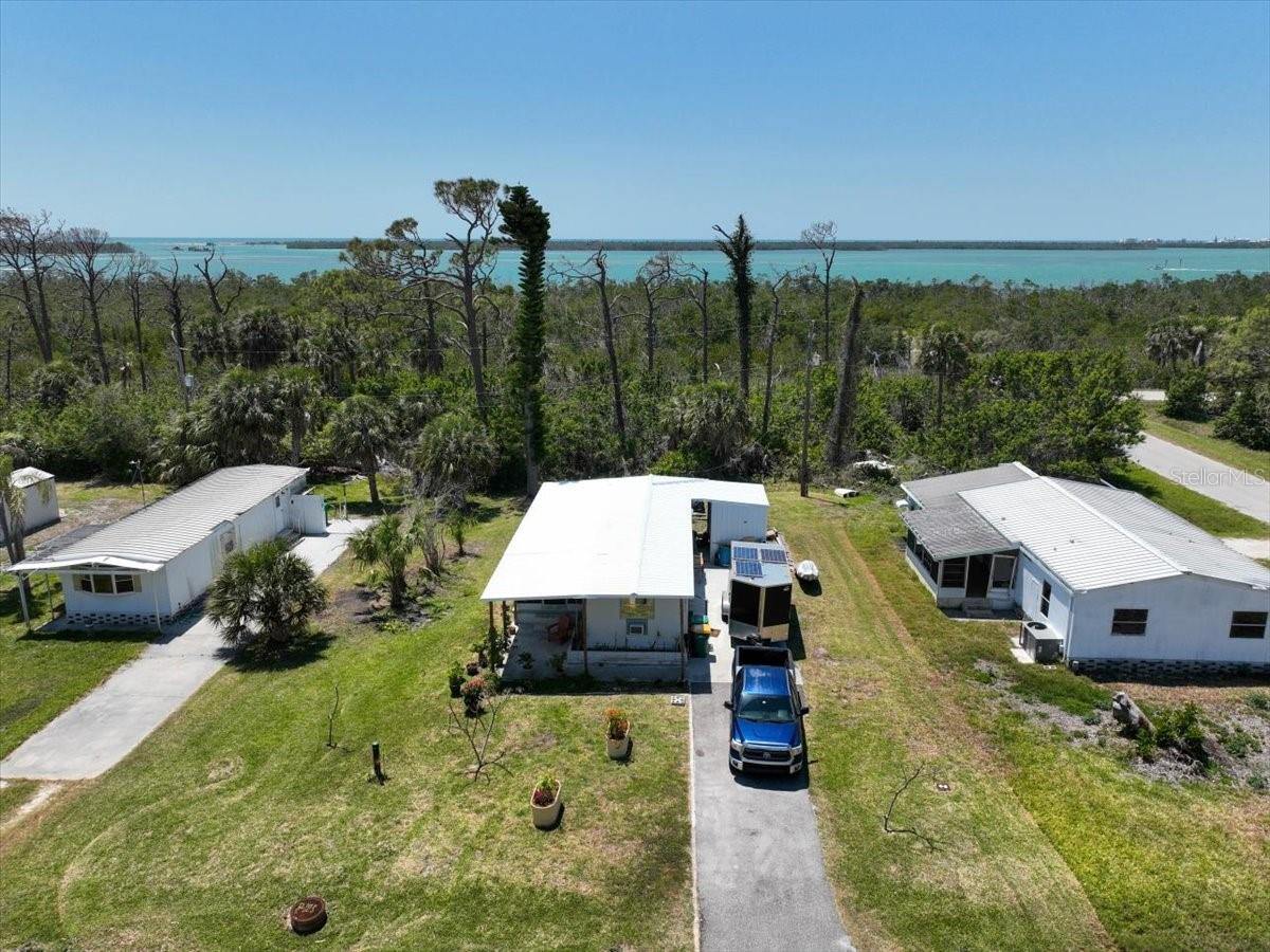 Here is your chance to own a coastal retreat in Florida. Centrally located on a quiet dead-end street in Grove City, enjoy having the freedom to create your own private sanctuary and not have to deal with deed restrictions or HOA rules. No pesky septic system or well water here thanks to city water and sewer hookups. Spend your mornings enjoying a cup of coffee on the screened lanai. This property is in close proximity to Englewood Beach, Stump Pass Marina, several public boat ramps, area parks and numerous restaurants. Did I mention that this property has a metal roof less than 2 years old! What more could you ask for - schedule your private showing today and start enjoying the Florida lifestyle and everything Englewood has to offer!
