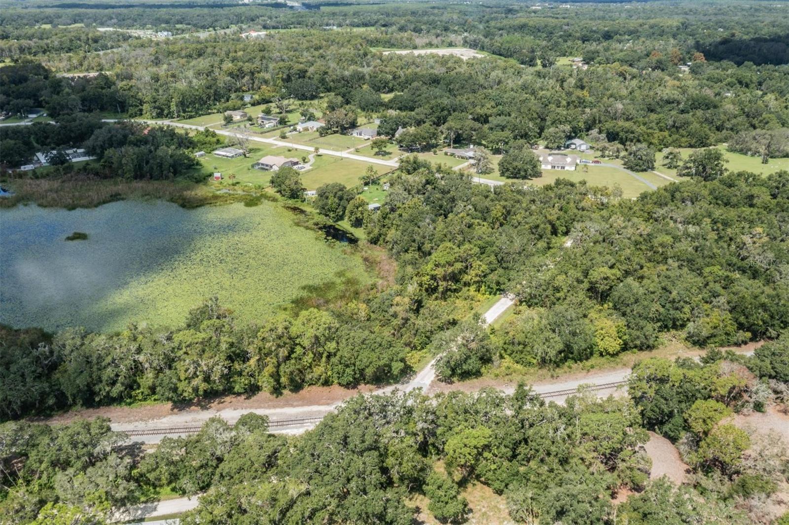 Here’s your chance to own a stunning 4-acre parcel offering the perfect blend of privacy, space, and convenience. With approximately 2 acres of high and dry buildable land, this property is ideal for building your dream home, starting a small farm, or creating a private retreat for you and your family. Located just off State Road 52, with quick access to US-41 and the Suncoast Parkway, this lot offers an easy commute to Tampa while still providing the tranquility of rural living. The property stretches from Giddens Avenue to Kent Grove Road, giving you an entire block of space and privacy — a rare and valuable feature! Whether you envision open pastures, a custom-built home, or a peaceful getaway surrounded by nature, this land offers the flexibility to bring your vision to life. The area is part of a rapidly growing region, near the exciting new Angeline community and several upcoming developments, making this not only a beautiful place to live but also a smart investment. No HOA. No CDD. Just land, freedom, and opportunity. Sellers are prepared to clear portions of the property.