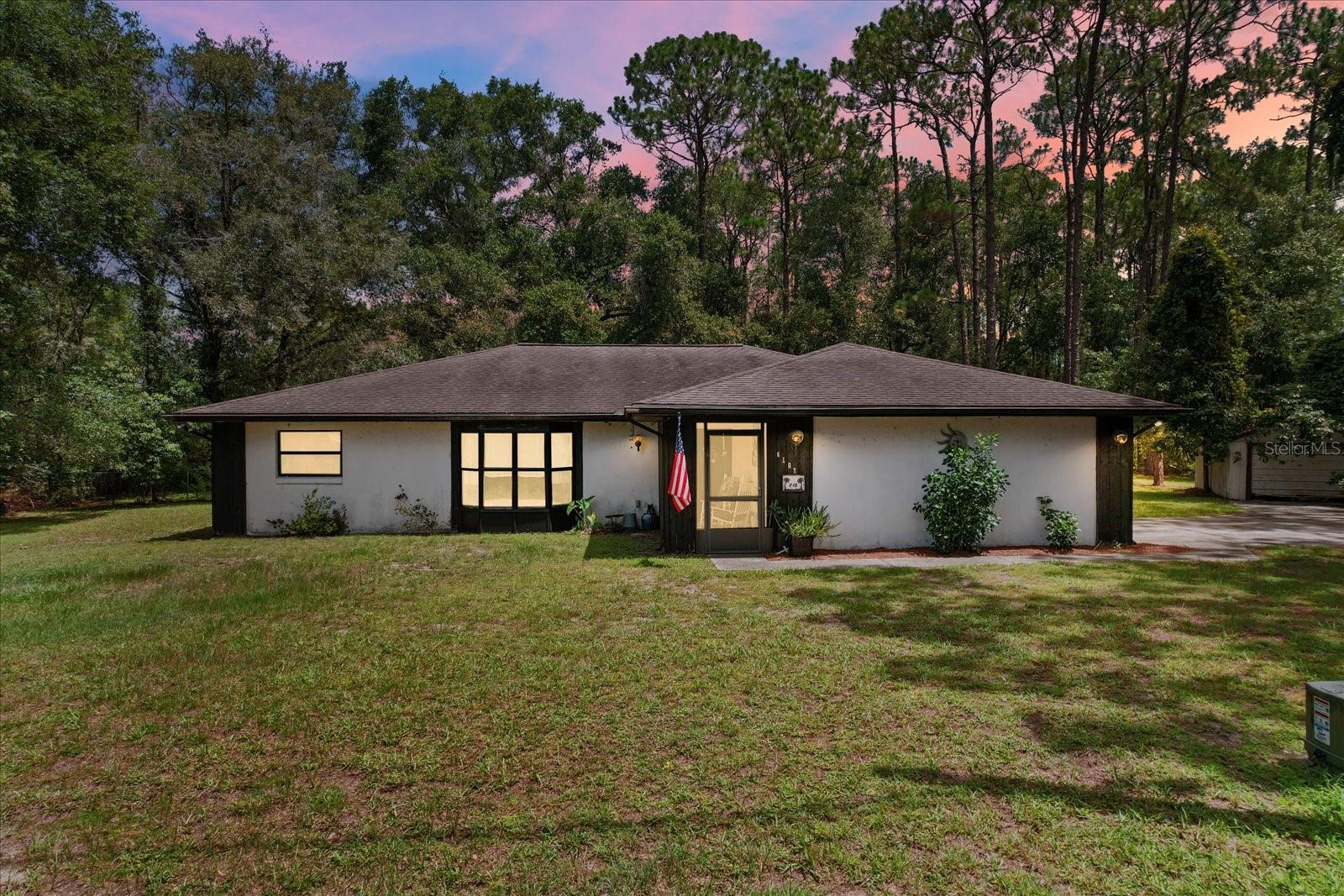 Public Remarks: Ready to ditch the hustle and bustle without being too far from the action? Check out this charming 3-bedroom, 2-bathroom home nestled on just under half an acre in a super quiet neighborhood. You'll love the spacious layout and the huge garage – perfect for all your toys or a fantastic workshop. Plus, you're only about 2 miles from town, making errands and nights out a breeze. The large, screened-in inground pool is ready for summer fun, it just needs a little bit of TLC to shine! This place has so much potential to be your private oasis. Come see it today!
