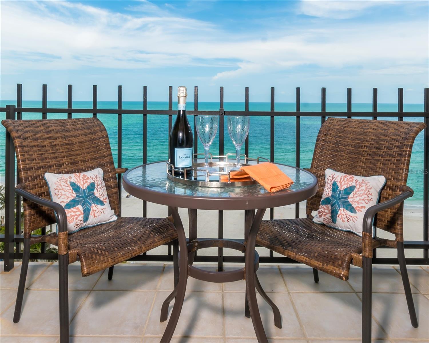 Direct Beachfront Luxury at The Lido Beach Club. Experience the pinnacle of luxury coastal living in this stunning 1,536 sq. ft. direct beachfront residence in the highly sought-after Lido Beach Club. Breathtaking panoramic Gulf views, a resort-style pool, and miles of pristine white sandy beaches, make this oceanfront sanctuary a rare gem. The Lido Beach Club elevates waterfront living with an impressive array of resort-style amenities, including deeded beach access, a newly renovated heated pool, a state-of-the-art fitness center with sauna, a library with game table, and a social lounge with a full kitchen—ideal for entertaining. Enjoy evenings by the fire pit or savor oceanfront dining at the grilling area. Residents also benefit from secure storage for beach gear and bikes! For a serene escape from it all, step out onto your private oceanfront balcony which is accessible from both the main living area as well as your bedroom area. Whether you step out for your morning coffee or an evening cocktail, this fabulous outdoor space is your own private sanctuary where you can sit back, relax and fully experience stunning sunsets and the soothing sound of ocean waves. Ocean vistas truly await you in this well-designed residence offering an open-concept layout designed to capture both natural light and coastal views. The primary suite boasts a private bath with walk-in tile shower, a private laundry, large walk-in closet, large windows, and direct balcony access. The second bedroom offers access to its own separate private balcony, where you can take in sweeping northern ocean views, creating a peaceful and scenic personal escape for guests or family. Location, location, location! Nestled on the pristine shores of Lido Key, this prime location is just minutes from the world-renowned St. Armands Circle, which offers an array of boutique shopping, fine dining, and vibrant entertainment. Outdoor enthusiasts can explore scenic mangrove tunnels, kayaking, fishing, biking, boating or simply enjoy a stroll along the picturesque shoreline of Lido Beach Park. Whether you drop-in at the Ritz-Carlton Tiki Bar next door or at the nearby Lido Beach Resort for a bite, you’re sure to find a perfect spot to mingle or unwind with a cocktail. OH YES! Live here at The Lido Beach Club and enjoy a real beach lifestyle —where luxury, comfort, and breathtaking scenery converge.
