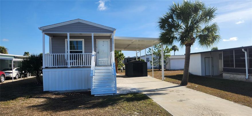 Discover relaxed Florida living in the highly desirable Caribbean Isles Residential Cooperative, a 55+ waterfront community known for its friendly atmosphere and active lifestyle. Built in 2023, this 2-bedroom, 2-bath home offers the benefits of modern construction with a warm, comfortable feel.

Inside, you’ll find a bright and open layout with high ceilings, vinyl flooring throughout, and plenty of windows that allow natural light to fill the space. The kitchen flows easily into the living and dining areas, making it ideal for both everyday living and entertaining. The primary bedroom includes a private en-suite bath, creating a peaceful retreat, while the second bedroom is perfect for guests.
Step outside and enjoy beautiful sunsets from your front porch, a perfect spot to unwind at the end of the day. An extra large covered carport provides generous parking and storage space. The home is conveniently located within a short walk to the clubhouse and community amenities.

Caribbean Isles offers exceptional amenities for residents who enjoy staying active and social. Take advantage of the kayak and boat launch with direct canal access to Tampa Bay, relax in the heated year-round pool, or enjoy classic Florida pastimes like bocce ball, shuffleboard, and horseshoes. The clubhouse features a craft room, game room, pool tables, card tables, indoor shuffleboard, and darts, along with a full calendar of community events, dinners, and dances throughout the year.
Ideally situated between Tampa and Sarasota/Bradenton, this location offers easy access to shopping, dining, beaches, and day-trip adventures.

If you’re looking for a newer home in a welcoming waterfront community, this one is well worth a look. Come see why so many residents are proud to call Caribbean Isles home.