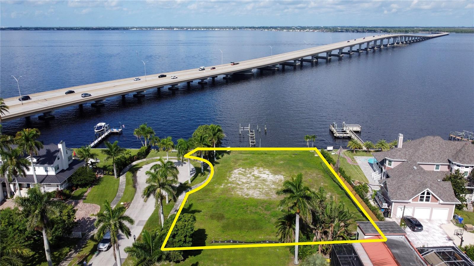 WESTERN EXPOSURE RIVERFRONT BUILD SITE! Unlock this rare opportunity to build your dream riverfront estate in the highly sought-after Historic McGregor Boulevard Corridor. This .43-acre property has already been cleared, and is ready for new construction. Offering breathtaking river views and an expansive footprint, it provides the perfect blank canvas to create a custom-designed residence built high and dry to meet today’s most stringent building codes, ensuring safety, value, and peace of mind for years to come. Life along McGregor Boulevard is the essence of Fort Myers prestige. Known for its majestic Royal Palms, many of which were planted more than a century ago under the vision of Thomas Edison and Henry Ford, the boulevard has grown into one of the most iconic addresses in Southwest Florida. Driving or biking along McGregor feels like stepping into a postcard of “Old Florida” charm, yet with every modern convenience just minutes away. This property’s location is second to none. Just a short distance from the Downtown Fort Myers River District, you’ll have access to waterfront dining, boutique shopping, art walks, and live entertainment year-round. The area also provides close proximity to top-rated hospitals, highly regarded schools, and major airports, making it both convenient and connected. Spend weekends enjoying nearby Gulf beaches, fishing charters, or kayaking along the Caloosahatchee River. Beyond lifestyle, this neighborhood is a true community. The McGregor corridor is lined with historic estates, luxury waterfront homes, and charming Old Florida residences, giving the area a sense of timeless prestige and enduring value. Very few vacant riverfront parcels remain in this historic stretch, making this a genuine once-in-a-generation opportunity to create a waterfront masterpiece tailored to your vision. Whether you are an investor seeking a premium property or a homeowner ready to design your forever home, this lot offers the best of both worlds: riverfront living, historic charm, and modern-day convenience.