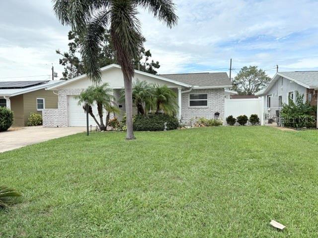 Charming Pool Home with a Spacious Backyard Retreat. Live the Florida lifestyle in this inviting sparkling pool home, complete with a professionally landscaped and fully fenced backyard—perfect for entertaining friends and family. Inside, you'll find durable concrete flooring throughout, with classic ceramic tile in the kitchen. An oversized bonus room adds flexibility, ideal for a home office, creative studio, or cozy den. Impact-resistant windows bring peace of mind and a quieter interior, shielding you from weather and outside noise. Curb appeal is strong, with a well-maintained exterior that welcomes you home. Conveniently located just minutes from downtown St. Petersburg, the beach, and the airport—this home brings it all together. Only three owners since 1968, no flood zone. A/C replaced 2023, Roof replaced 2017, and pool built in 2021 and equipment replacement in last year.