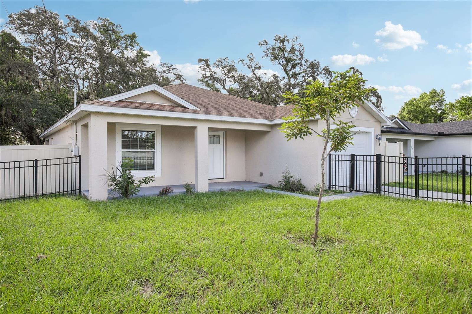 One or more photo(s) has been virtually staged. This beautifully updated home sits on a spacious, fully fenced corner lot and is truly ready for its next chapter. Just minutes from Busch Gardens, Temple Terrace, USF, Moffitt, and I-275, you’ll be in the heart of convenience while tucked into a welcoming neighborhood.
Step inside to an open layout that feels both roomy and comfortable, with wood-look porcelain tile running throughout the main living areas. The kitchen is a standout with its generous granite island, stainless steel appliances, and tons of cabinet storage—ideal for weeknight meals or weekend gatherings. It opens right into the family room so everyone stays connected.
All three bedrooms are freshly carpeted (brand new as of July 2025), offering a cozy space to wind down. Both bathrooms have a polished, modern feel with granite counters, under-mount sinks, and floor-to-ceiling tiled tub and shower areas. The primary bath features a sleek rimless glass shower—just one of the many thoughtful touches throughout the home.
Impact-resistant windows add peace of mind, a fully fenced yard, and with no flood insurance required, it's a smart move all around.
Don’t miss the chance to see this home in person—it might be exactly what you’ve been waiting for!