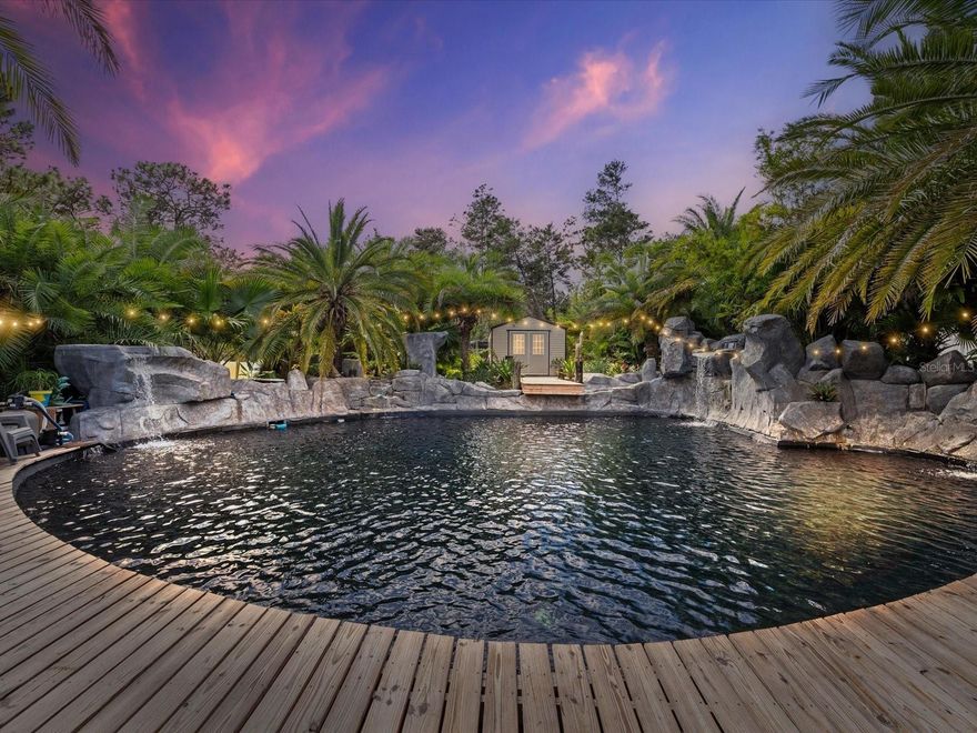 This RESORT STYLE pool makes you feel like you are living everyday on vacation! The beautiful 2021 built home sits on a .55 acre lot with no HOA! 3-bedroom, 2-bathroom home with a den/office, combines luxury living with ultimate outdoor experience! Step inside to find a bright, open floor plan featuring a beautiful kitchen with upgraded cabinets, sleek granite countertops, stainless steel appliances, and plenty of space for cooking and gathering. The home offers a split-bedroom layout, a cozy den or office, and a 2-car garage. But the backyard? That’s where the magic happens. Step outside to your tropical paradise a tropical resort-style oasis designed for serenity and relaxation. Dive into a lagoon-style pool surrounded by lush landscaping, complete with six cascading waterfalls and a tranquil back pond that flows into the main pool. Entertain in style on the huge deck with a gazebo and a full tiki bar featuring two mini fridges, a kegerator, ice maker, and sink, the ultimate setup for parties or peaceful evenings under the stars.
The property also includes two storage sheds, a fully fenced yard, and meticulously designed landscaping that makes every corner feel like paradise.This home truly offers resort living without ever leaving home. A one-of-a-kind retreat that must be seen to be believed! SELLER IS INVITING ALL SERIOUS OFFERS.