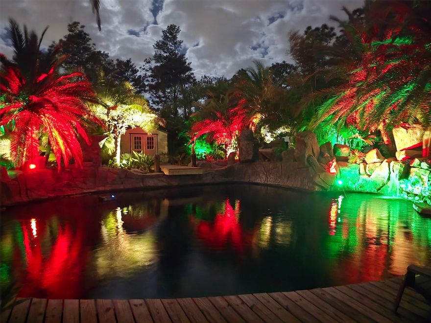 Ever dreamed of living in a resort but without the wristbands, the strangers in matching towels, or the all-you-can-eat buffet shame? CONGRATULATIONS! Your dream has arrived! This 2021-built tropical paradise sits on .55 acres with NO HOA, which means you can live your most glamorous Florida life without anyone telling you your flamingo décor is “too much.”Inside, this 3-bedroom, 2-bath home with a den/office delivers all the comfort and style you could want. The bright, open floor plan features a stunning kitchen with upgraded cabinets, granite countertops, stainless steel appliances, and enough counter space for actual cooking or, you know… displaying takeout menus. The split-bedroom layout offers privacy, the den makes the perfect office or guilt-free nap room, and the 2-car garage gives you plenty of storage for cars and questionable Costco purchases. But let’s be honest: The backyard is the main character.Step outside and prepare to instantly forget what day it is. Your very own resort-style lagoon pool awaits. Complete with six cascading waterfalls, lush landscaping, and a peaceful back pond that flows into the main pool like nature’s own special effects department. The huge deck, gazebo, and full tiki bar scream “Let’s entertain!” with two mini fridges, a kegerator, an ice maker, and a sink. Basically, it’s a fully functioning outdoor party headquarters or the perfect place to sit alone and pretend you're on vacation in Tahiti while sipping a beverage and ignoring emails.You also get two storage sheds, a fully fenced yard, and landscaping so well-designed it deserves its own Instagram account. This isn’t just a home, it’s a lifestyle, a mood, a whole personality. And yes, it’s absolutely a one-of-a-kind retreat you need to see to believe. SELLER IS INVITING ALL SERIOUS OFFERS- so bring yours before someone else claims this backyard paradise and forces you to live with regret.