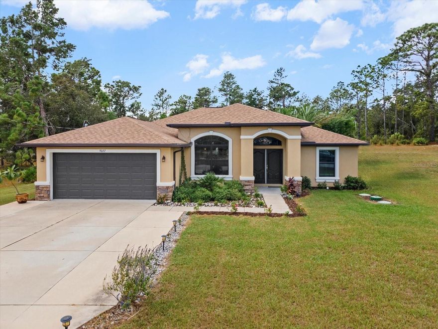 Welcome to the MAVIS LAGOON! Get ready to live everyday like you are on vacation! This stunning 3-bedroom, 2-bathroom home with a den/office, perfectly situated on a spacious .55-acre lot with no HOA! Built in 2021, this modern beauty combines luxury living with ultimate outdoor experience!Step inside to find a bright, open floor plan featuring a beautiful kitchen with upgraded cabinets, sleek granite countertops, stainless steel appliances, and plenty of space for cooking and gathering. The home offers a split-bedroom layout, a cozy den or office, and a 2-car garage. But the backyard? That’s where the magic happens. Step outside to your tropical paradise a tropical resort-style oasis designed for serenity and relaxation. Dive into a lagoon-style pool surrounded by lush landscaping, complete with six cascading waterfalls and a tranquil back pond that flows into the main pool. Entertain in style on the huge deck with a gazebo and a full tiki bar featuring two mini fridges, a kegerator, ice maker, and sink, the ultimate setup for parties or peaceful evenings under the stars.
The property also includes two storage sheds, a fully fenced yard, and meticulously designed landscaping that makes every corner feel like paradise.This home truly offers resort living without ever leaving home. A one-of-a-kind retreat that must be seen to be believed!