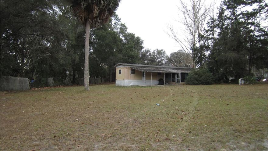 Great Investment Property!  This move in ready Mobile Home with split floor plan 2/1.5 , Full Kitchen with small dining area , Living Room, Laundry with Washer, a Large Screened in Front Porch, carport, Shed, property is .43 of an acre located in a small rural community right off HWY 200 paved road. Just minutes from Hospitals, Walmart, Mall , Dinning , Rainbow River Springs. Lots of recreational parks with trails for walking, biking, fishing, kayaking, Boating and much more!!