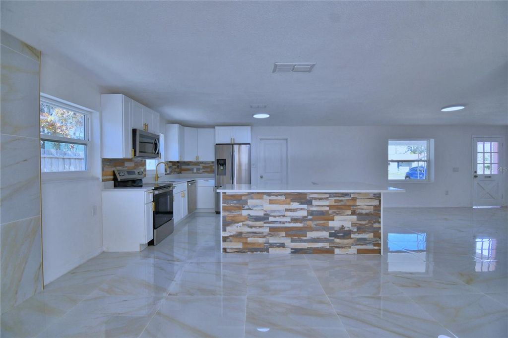 Photo of 5504 Sedgefield Street, Orlando, FL 32808 (MLS # O6372888)