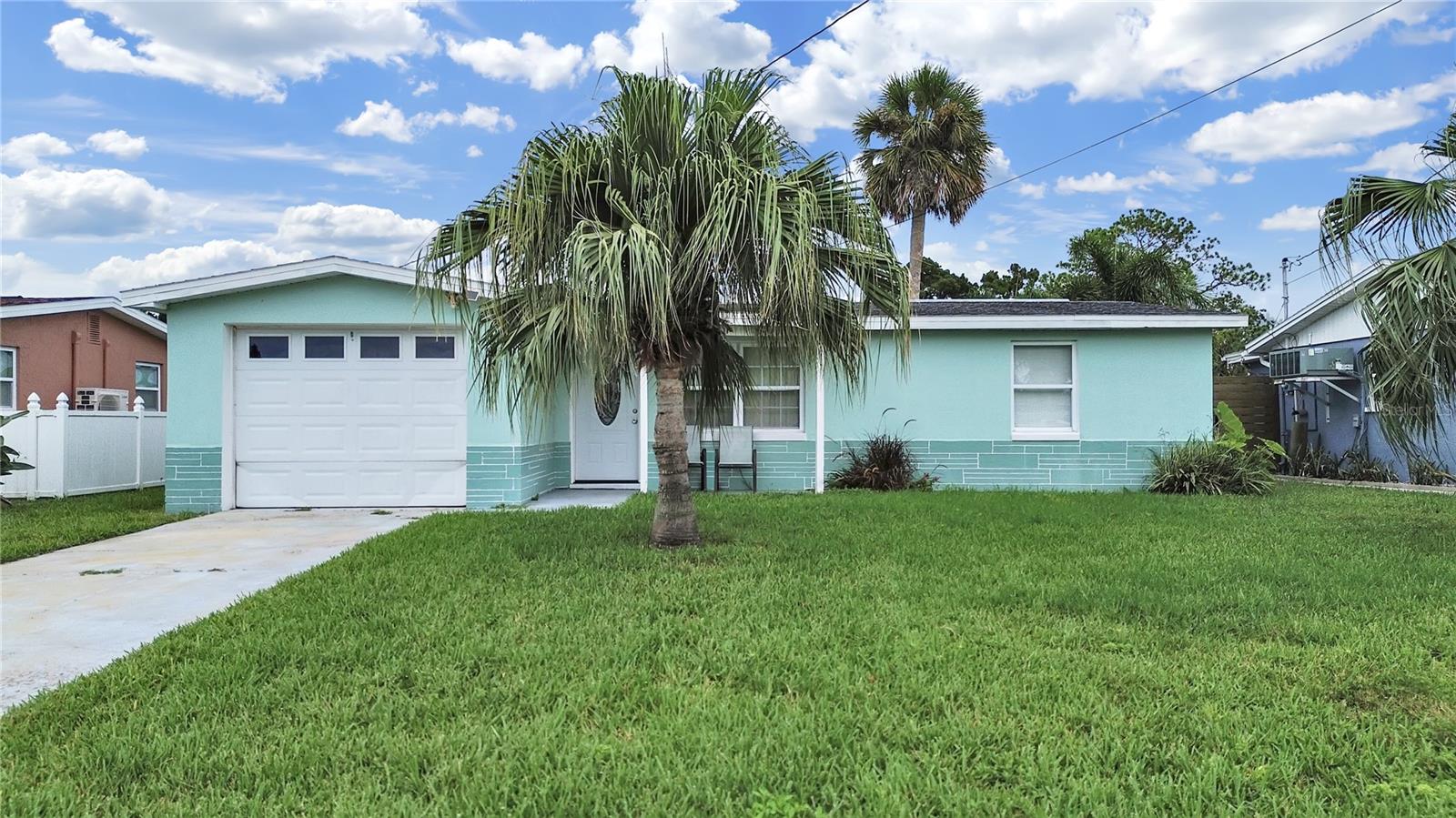 Welcome to your waterfront paradise! With a new dock, boatlift and seawall this home becomes the boaters dream with only 5 minutes out to the gulf! The home has a open floor plan that has been maintained. New Awning, Ac 2024, Ceramic tile throughout . Roof 2012, Hot water tank is 2024 . Home is completely fenced with a shed to keep all your tools in. Shopping, schools and a short drive to US19 . .Book your showing before its too late!