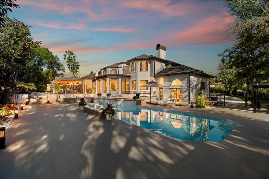 Presenting a newly remodeled luxury estate ideally positioned along Isleworth’s renowned championship golf course, showcasing stunning views of the signature 3rd hole. This exceptional residence offers approximately 5,376 square feet of refined living space with 6 bedrooms and 6 bathrooms, soaring ceilings, elegant formal living and dining rooms, a private office, and a spacious owner’s retreat.
Designed for elevated living and effortless entertaining, the home features marble and luxury vinyl flooring throughout and a beautifully upgraded chef’s kitchen with a casual dining area. The fully reimagined front and rear grounds create a true estate setting, highlighted by a grand front fountain entrance, a resort-style pool, an expansive lanai, a pavilion, and a summer kitchen.

The upper-level balcony offers breathtaking golf course vistas, while the fully fenced private grounds include an extended driveway and an impressive circular motor court. A rare opportunity to own a move-in-ready luxury residence in one of Isleworth’s most prestigious golf-front locations.