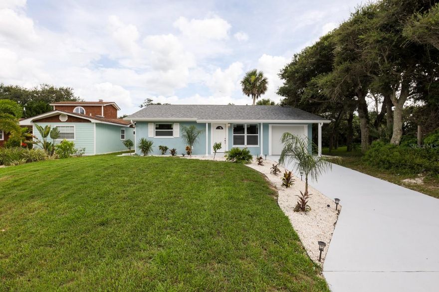 Welcome to your New Smyrna Beachside home.  Completely remodeled 3 bedroom 2 bath block house, walking distance to the beautiful shores of NSB.  Plenty of room for all your beach toys and easy access to our finest shops and restaurants.  Upon entry you will fall in love with your new open floor plan.  Stylish New Vinyl Plank flooring through out the entire home.  Your Brand New kitchen is equipped with 5 burner glass top stove, tons of counter and cabinet space and room for storage.  LED can lights through out.  New  ceiling fans and decorative lighting.  Master bedroom was added to the back of the home and has attached en-suite bath with double vanity and walk in shower with overhead rain head.  New Double paned low E impact resistant windows and sliders through out this home make it safe and every efficient.  Split plan layout separates the 2 guest bedrooms from the master.  All new guest bath with tub.  New 75 GALLON  Hot water heater.  AC 2015 recently serviced and ducts cleaned.  New Roof installed 2017.  Fresh paint inside and out.  Outside of home new Stucco.  Backyard is a blank canvas waiting for your ideas.  Plenty of room for a pool. New garage door and opener with room for your Golf Cart.  Isnt it time you start "Living the Dream" in NSB today!! ;Water: City