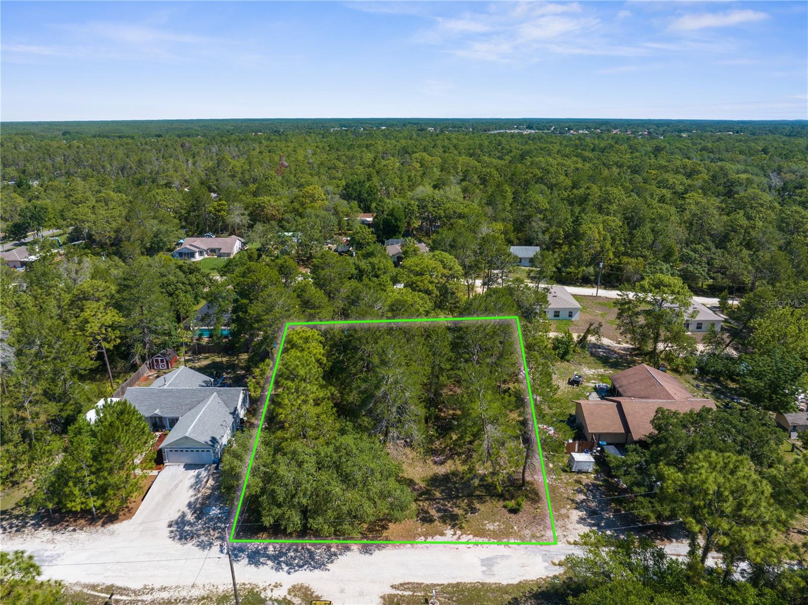Build your dream home on this 1/3-acre lot. There is NO HOA, NO CDD and NO FLOOD zone. This lot is on the high side of the road, so you are on the top of the hill!!! Prime location with Weeki Wachee Springs State Park just minutes down the road. Check out the famous mermaid show, take a swim in the freshwater spring and enjoy the water slides. You can take a short drive to Pine Island to watch the sunset or have breakfast, lunch or dinner in Hernando Beach with so many restaurants to choose from. You're a short distance from shopping centers and grocery stores. Don't miss your opportunity to build in a prime location!!