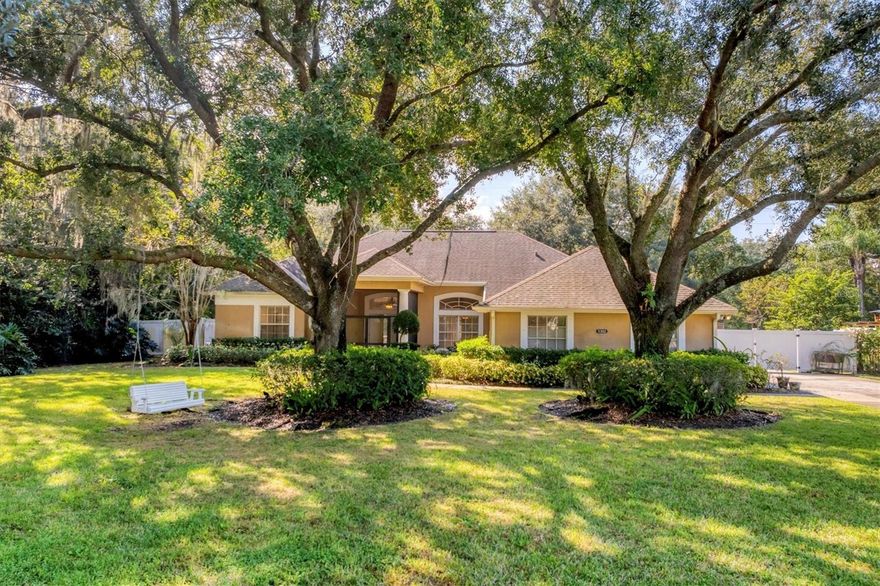 Nestled within a stunning gated neighborhood that captures the essence of true Old Florida living, this community stands apart from today’s typical cookie-cutter developments. Meandering streets shaded by towering old oak trees draped in graceful hanging moss create a serene, storybook setting. This captivating home draws you in from the moment you arrive, featuring a long driveway framed by mature landscaping. A screened-in front porch offers a warm, inviting entry. Inside, the home offers a desirable split floor plan with 4 spacious bedrooms and 2 full bathrooms. The large kitchen with a breakfast bar opens to the living spaces, ideal for gatherings and everyday living. A cozy wood-burning fireplace in the family room adds comfort and charm. Step outdoors to your private oasis from the living room or family room. The tranquil screened-in pavered pool area includes a full outdoor kitchen equipped with a grill, refrigerator, and sink—perfect for entertaining or unwinding after a day on the lake. The lanai also offers convenient access to a pool bath, making outdoor living effortless. A spacious side-entry three-car garage ensures plenty of parking and storage, while the expansive half-acre lot (back and side yard is  fenced) gives your family plenty of room to roam, play, and enjoy the outdoors. The large side driveway has plenty of room to accommodate a boat.The community boat ramp provides access to Lake Ajay, Fells Cove Lake and East Tohopekaliga Lake.
Just minutes away, you’ll find the vibrant Lake Nona community, known for its exceptional dining, shopping, entertainmenstate-of-the-art medical facilities, and innovative technologies. You’re also conveniently close to Orlando International Airport (MCO), making travel stress-free and providing easy access for visiting friends and family. Bring your boat, bring your tennis racquets and pickleball paddles and step into the relaxed, beautiful lifestyle that awaits you near Lake Nona!