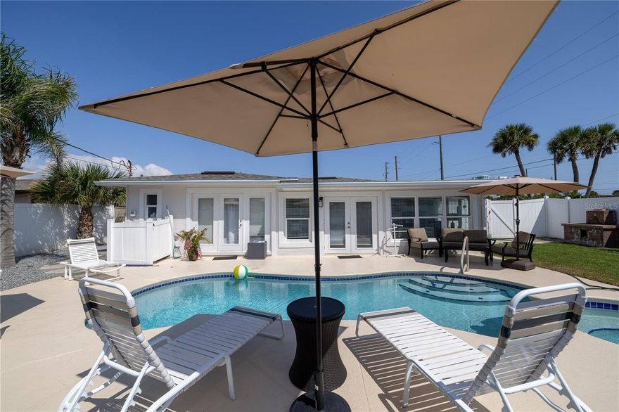 December 2025 available and Thanksgiving week! Sorry 2026 winter is already booked. 
Available months available and their monthly rent. Each rental comes with a $300 cleaning fee and $75 booking fee
December $4000
May $4000
June $6000 
July $6000
August $4000
September through November $3800

Come visit this awesome heated pool home in the heart of New Smyrna!   Only a mile from the Famous Flagler ave with all the best restaurants, shops, and nightlife.  The home has everything you need to enjoy your vacation and very close to everything on this unique island with 13 miles of coastline. You are directly across the street from the beach,  restaurants,  and a tiki bar overlooking the beach.   This home has 3 bedrooms, 2 full baths, 2 living rooms with 1 having a door to close off with a desk if you need to work from home. The back yard is the perfect oasis to relax with the pool, great landscaping, and two patio tables with an umbrella to eat your meals by the pool. The master bedroom has a queen sized bed with an en-suite master bathroom that has a walk in shower and french doors going out to the pool. The 2nd bedroom has a king sized bed, and 3rd bedroom has two twin beds sharing a full bath including a tub.  And lets not forget about an interior laundry room. This home is perfect for 2 families on vacation together or one large family. Yes this home is pet friendly with a $250 pet fee per pet, 2 maximum limit for pets.  Large Fenced in back yard for your furry friend just not allowed in the pool.