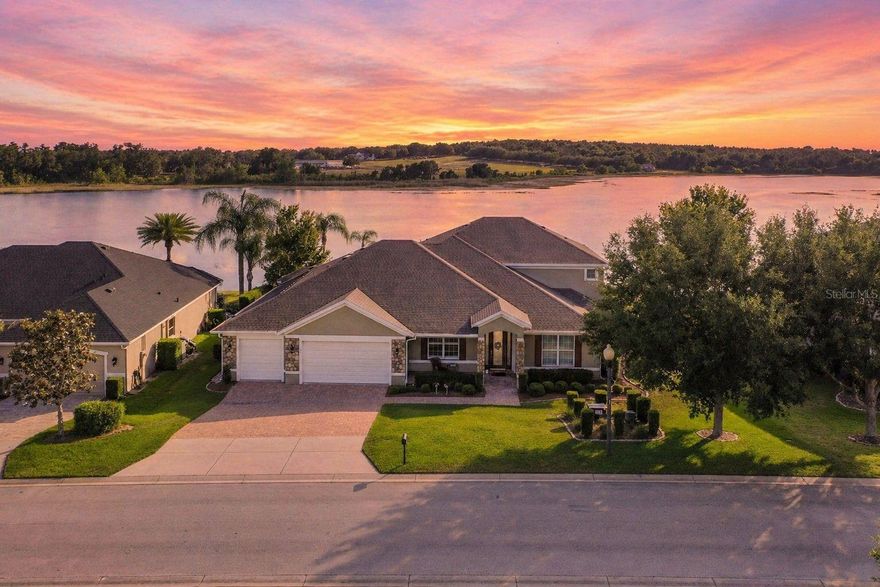Welcome to this custom-built, one-owner lakefront estate on Little Lake Nellie—one of Clermont’s premier skiable lakes known for its beautiful sunsets and excellent fishing. Perfectly positioned on a .44-acre homesite, this meticulously maintained 6-bedroom, 4.5-bath pool home offers 3,833 square feet of thoughtfully designed living space, ideal for both everyday living and multi-generational needs. From the moment you enter, you’ll appreciate the spacious layout and attention to detail. The heart of the home is the gourmet kitchen with stainless steel appliances, granite countertops, and seamless flow into the large family room with custom built-ins—perfect for gathering and entertaining. A formal dining room adds elegance for special occasions, while wood-look tile throughout the main living areas offers both beauty and durability. The main level features a private primary suite with stunning lake views, wood flooring, dual closets, and a luxurious ensuite bath with dual vanities, soaking tub, and separate shower. A dedicated office on the first floor can easily function as the 6th bedroom. Designed with flexibility in mind, this home includes a fully equipped in-law apartment with its own private entrance through the 3rd car garage, featuring a full kitchen, living room, bedroom, bathroom, and private lanai overlooking the lake—ideal for extended family, guests, or income potential. Upstairs, you’ll find three additional bedrooms, including a Jack-and-Jill bath and a private ensuite, along with a spacious loft area perfect for a media room, playroom, or additional living space. Step outside to your private backyard retreat featuring a solar-heated PebbleTec pool and spa, complete with a dedicated pool bath—perfect for enjoying Florida living year-round while taking in breathtaking sunset views over the water. Additional highlights include a 3-car garage, pavered driveway, large laundry room with drop zone, new roof (2024), and new main AC (2026), offering peace of mind for years to come. Located in a prime Clermont location with convenient access to shopping, dining, hospitals, and major roadways, this lakefront property offers the perfect balance of luxury, comfort, and lifestyle. If you’ve been searching for a move-in ready lakefront pool home with space, flexibility, and unbeatable views—this is the one.