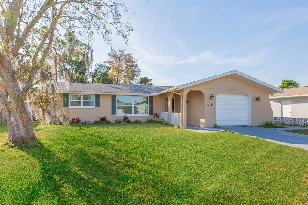 Photo of 7336 Cherry Laurel Drive, Port Richey, FL 34668 (MLS # TB8473485)