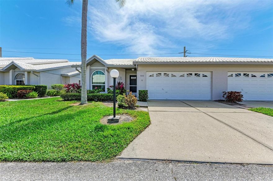 Nestled in the heart of Sarasota, lies the picturesque community of Crestwood Villas, a neighborhood that is the perfect place to call home. Meticulously maintained, this stunning three-bedroom, two-bathroom villa is sure to impress. Upon entry, the soaring vaulted ceilings are both architecturally pleasing and give the residence a large feel. The spacious living room is attached to the dining room which is a layout affording many different options. Tastefully updated to feel modern yet homey, the kitchen is perfect for the most discerning of chefs. Featuring stunning granite countertops, tons of massive light cabinets, gorgeous backsplash and more, the kitchen is open to the family room with a passthrough to the dining room making entertaining a breeze. Both secondary bedrooms are spacious and well-appointed, and the master bedroom is the perfect place to unwind and offer the feeling of true comfort. Beautifully updated, the master bathroom is a sight to behold. With not simply two, but three sinks, there is no shortage of space to get ready. The sunroom is the perfect place to enjoy a morning coffee or evening cocktail, and the screened-in lanai offers complete respite to enjoy our gorgeous Florida weather. Crestwood Villas is a beautiful maintenance-free community offering a plethora of amenities including a pool, clubhouse, tennis courts, pickleball courts and more!