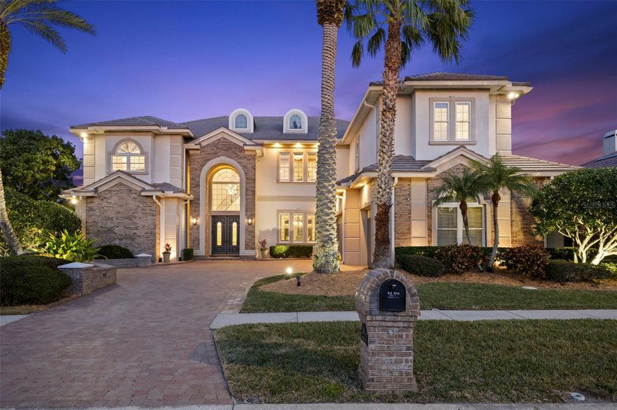 Discover refined elegance with this executive WATERFRONT residence with BAY and GULF ACCESS in the heart of Tampa! Designed for the luxury buyer, this breathtaking WATERFRONT estate combines grandeur and intimacy, epitomizing sophisticated living. Four expansive bedrooms, accompanied by four full and two-half bathrooms, ensure lavish comfort. A home office, theater room, and opulent billiards and bar room extend the luxury lifestyle. Your journey begins through the grand double door entrance, leading into a dramatic two-story spiral staircase foyer. The formal dining room provides an enchanting setting for elegant gatherings. The two-story great room is a blend of luxurious warmth and majestic splendor-highlighted by a gas fireplace with a marble surround, topped with graceful French doors, transoms, and opulent chandeliers. The heart of the home, a chef’s kitchen, has been designed without compromise. This epicurean haven offers a gas range with double ovens, a Miele built-in coffee machine, an island complete with a produce sink, a wine refrigerator, and a workstation. An large walk-in pantry, equipped with a full-sized refrigerator and freezer, delivers unparalleled storage solutions. Adjoining the kitchen, the glamorous half bathroom, with its curved ceiling and marble inlays, emphasizes the home's attention to detail. The BILLARDS & BAR room, reminiscent of vintage allure, features a fireplace, belly-up bar, dual wine fridges, ice maker, and a bar sink-setting the stage for entertaining magic. Conveniences abound with a full pool bathroom adjacent to the HOME THEATER. The MEDIA ROOM invites relaxation in a comforting and intimate space. Upstairs, all bedrooms are thoughtfully positioned. The distinguished primary suite, with natural light and commanding WATER VIEWS, offers a serene sanctuary. Escape to the private seating area for a quiet place to read and unwind. The primary bathroom offers amenities of a wet bar, dual walk-in closets, two water closets, a soaking tub, a makeup vanity, and a frameless walk-in shower. Positioned away from shared spaces, the home office provides privacy while boasting floor-to-ceiling built-ins. Walk along the catwalk to the first additional bedroom, offering an ensuite bathroom, extending the suite-like experience. Each additional bedroom is custom-fitted with built-out closets, meeting every storage need. Discover a BONUS ROOM off the upstairs porch, utilized as a home gym, further enriching your lifestyle. Embrace the Florida lifestyle year-round on your screened-in porch. The OUTDOOR KITCHEN is equipped with an Alfresco gas grill, a hood, and a refrigerator. Overlooking the heated saltwater pool and spa, this luxurious outdoor haven promises endless leisure. The newly extended COMPOSITE DOCK provides a platform to serene FRESHWATER views.  Take the canal to access TAMPA BAY WATERS via a community BOAT LIFT.  Meticulously curated and impeccably maintained, this residence boasts numerous upgrades including a propane tank, generator, central vacuum, instant hot water in the primary suite, advanced whole-house water treatment systems, resurfaced pool and spa, a mosquito comfort system, and new outdoor lighting. As part of an exclusive WATERFRONT GATED COMMUNITY, this magnificent home affords amenities like pickleball courts, a park/playground, and a dog park, all within minutes of the airport and downtown Tampa.  This is luxury redefined, an unparalleled opportunity for those with exquisite tastes.