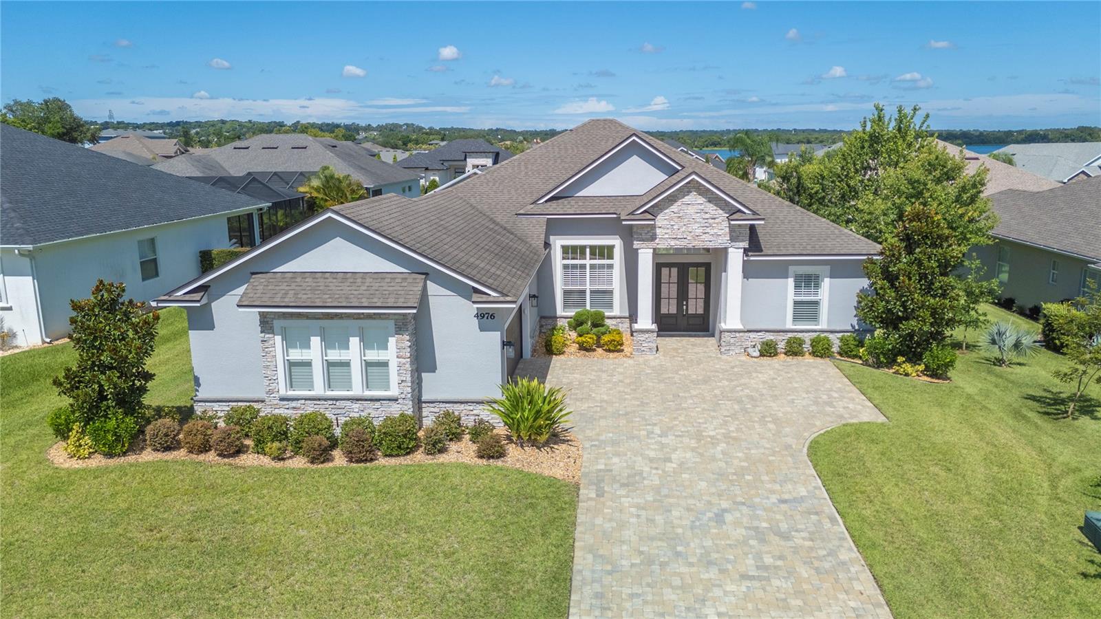 Welcome to your own slice of paradise in the gated community of Lakeside Heritage, with a peaceful view of Banana Lake right from your back porch! Built in 2020 by the well-respected Tapia Construction, this one-owner beauty offers 4 bedrooms, 3 bathrooms, and a bonus flex room that’s currently a formal dining space—but would make a perfect office, playroom, or cozy den.
Step inside and enjoy the tri-split floor plan that gives everyone their space, plus charming touches like plantation shutters throughout and an electric fireplace for those rare cool Florida nights. The living room opens up with triple sliding doors to the back porch—perfect for morning coffee or evening sunsets. And yes, the hot tub stays!
Need room for all the toys? The 2-car garage offers the space of a 3-car, giving you extra room for storage, a gym, or workshop. Outside, enjoy the added privacy of mature hedges already in place, and rest easy with a low HOA that still provides gated peace of mind.
This is more than just a house—it’s a lifestyle. Come see why Lakeside Heritage is where you’ll want to call home!