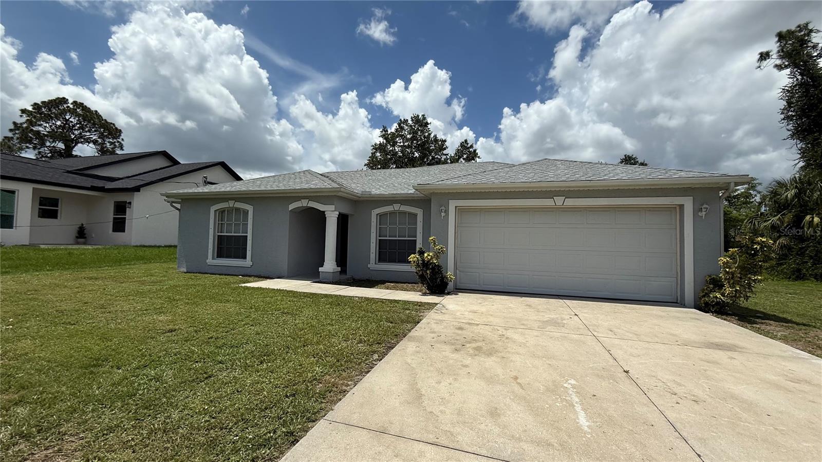 This well-maintained 3-bedroom, 2-bath home offers comfort and space, inside and out. Featuring no carpet throughout, the home is easy to maintain and move-in ready. The kitchen includes freshly epoxied countertops, clean appliances, and plenty of room to cook and entertain. Each bedroom is generously sized, offering great natural light and ample closet space. Step outside to enjoy a large screened-in Lanai perfect for relaxing or hosting guests and a spacious backyard with room to play or garden. Located in a quiet neighborhood, this home checks all the boxes for easy Florida living. Owner will consider a small pet. Schedule your showing today!