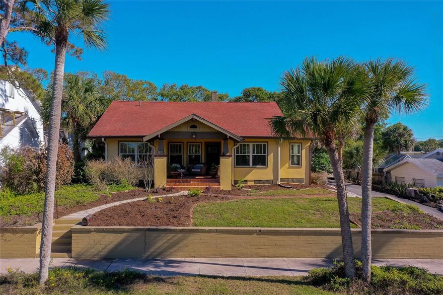 Just moments from the river and the beach, this fully renovated 3-bedroom, 2-bath historic home blends original character with thoughtful modern updates. Built in 1928, the home offers 1,793 square feet of refreshed living space, including a private upper-level primary suite. Hardwood floors, natural light, and a painted brick fireplace define the main living area, which connects easily to a dining space with built-in cabinetry. The inviting kitchen is both functional and cleanly designed, featuring quartz countertops, white cabinetry, stainless steel appliances, a farmhouse sink, and subway tile backsplash. Additional spaces include a bright sunroom - ideal for a home office or studio, and a secondary living area suited for a media room or lounge. The home has been carefully maintained and thoughtfully curated adding a subtle sense of creativity and intention throughout. Upstairs, the primary suite features vaulted ceilings, an exposed brick accent wall, an en-suite bath with walk-in shower, and a small bonus area for a reading nook or workspace. Additional bedrooms on the lower level offer flexibility for guests or office use. Outside, enjoy a covered front porch, newly paved driveway, and a spacious backyard with mature landscaping. A basement/cellar provides additional storage. Conveniently located near the river and the beach, this move-in-ready home offers a unique opportunity to own a piece of East Daytona history with modern comfort. All information recorded in the MLS is intended to be accurate but cannot be guaranteed.
