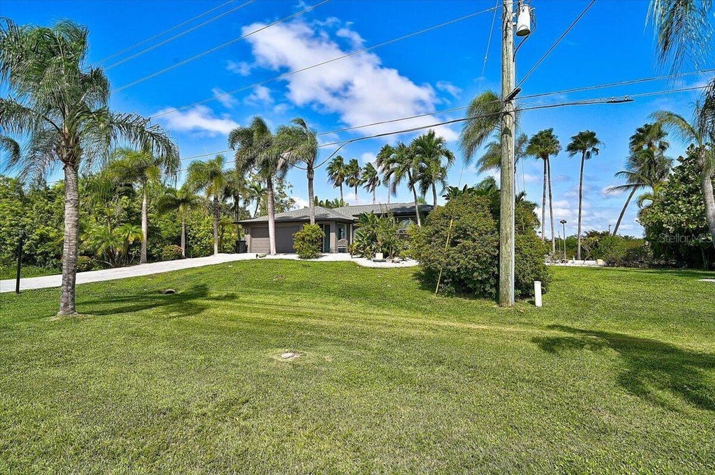 Photo of 8877 Calumet Boulevard, Port Charlotte, FL 33981 (MLS # O6452062)