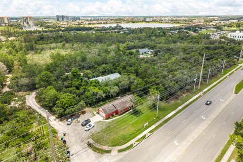 Photo of 11253 S Apopka Vineland Road, Orlando, FL 32836 (MLS # O6421830)
