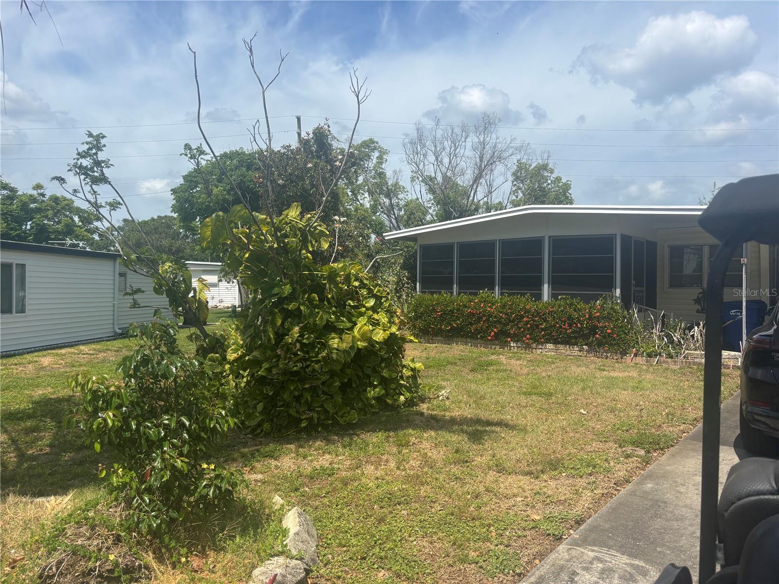 Home for sale in the most sought after manufactured home community in Pinellas Country. Lake Tarpon Village, where you own your own land, where the land is valued at $98,600 by county assessors office. Needs some TLC, but priced to sell. Located in cul-de-sac. Air conditioning unit is a 2012, and home has a roof over. Large shed with washer and dryer. Low association fee of $106.70, which covers twice a week garbage pick up and association amenities. HOA is tied to social security, only increases when social security increases. Not in dog section, cats okay. Enjoy the 55+ lifestyle with newly remodeled pool and clubhouse. Join many clubs, such as golf, shuffle, bocce, book, cards, crafts, etc. Very active community. Close to restaurants, beaches and two airports. Don't miss out on this opportunity. Seller to hold an estate sale July 18-20. Realtor will be present most of the time. Buyer or buyers agent to verify measurements.