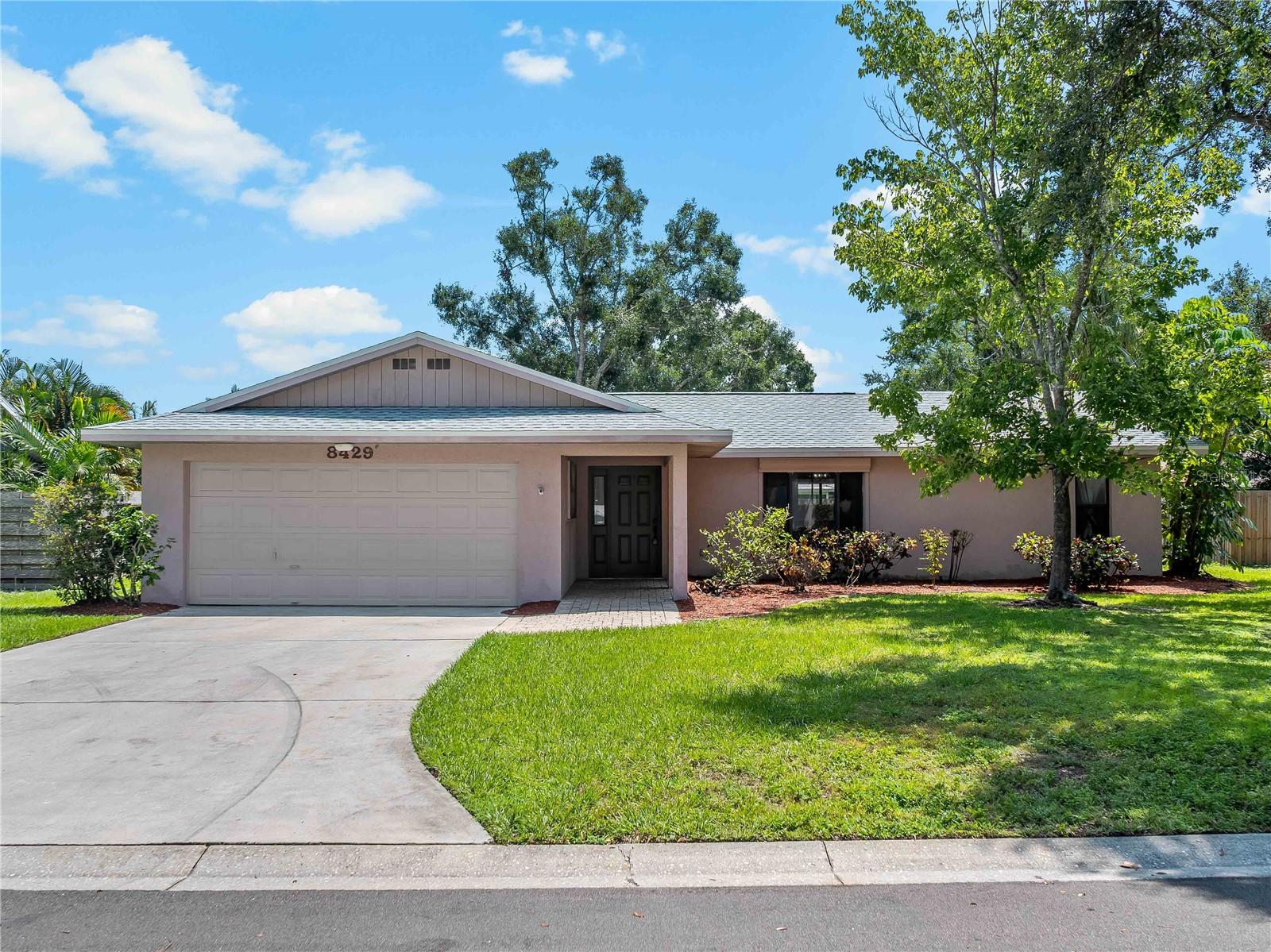 Welcome to this beautiful 3 Bedroom, 2 Bath, 2-Car Garage home located in the highly sought-after community of Country Oaks. Designed with a desirable split floor plan, this residence offers comfort and privacy for all. Step inside to find a freshly painted interior and luxury vinyl plank flooring that flows seamlessly throughout the entire home. The kitchen is the heart of the home, featuring stainless steel appliances, granite countertops, surrounded by two spacious living rooms and a dining area—perfect for both daily living and entertaining. A versatile bonus room provides endless possibilities as a playroom, office, or additional living space. The primary suite boasts a large walk-in closet and walk-in shower, while the generous sized guest bedrooms and guest bath are thoughtfully positioned on the opposite side of the home. Recent updates include a new roof (2025) and A/C (2018), offering peace of mind for years to come. Country Oaks has low HOA fees and no CDD fees. There is a community pool and tennis courts. The neighborhood is just a short stroll to Conservatory Park. Ideally situated, this home is only 10 minutes to University Town Center, 20 minutes to Downtown Sarasota, and 30 minutes to Lido Key and St. Armands Circle. Schedule your private showing today! Video and 3D tour attached to listing.
