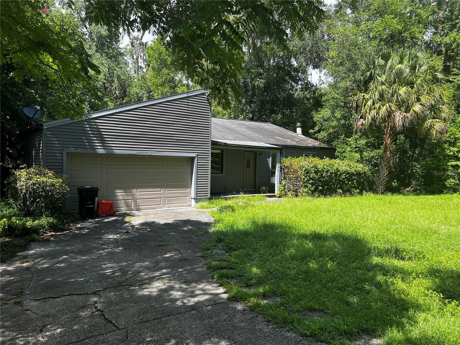 Highest and Best Due 7/31/25 by 5PM - Priced for quick sale - House is a diamond in the rough, yet has incredible potential. Excellent location with close proximity to UF and downtown on a beautiful street. Home in unique style with high ceilings, lots of natural light and peaceful backyard with large pool and big lot that goes to the back street.