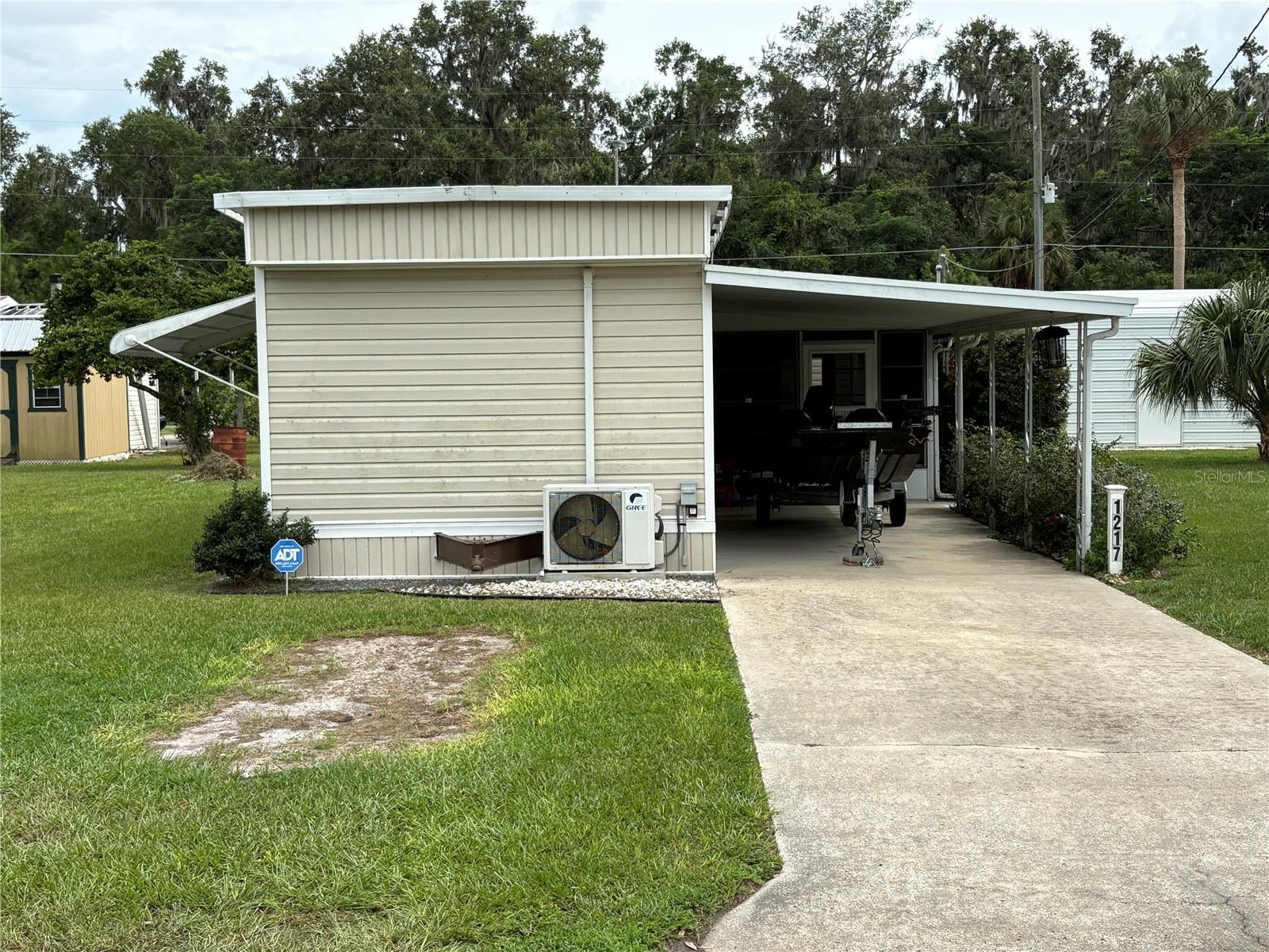 This is a very well maintained single wide mobile home with recent remodeling and new updates. The home comes furnished with recent kitchen appliances, new hot water heater, new toilet, 70 inch TV, portable dishwasher with stand, etc.. The other home furnishings are negotiable if buyers are interested. The home has two nice 10 X 12 outbuildings with one being used as laundry room and the other for lawn equipment. The home has a covered carport and concrete driveway.
