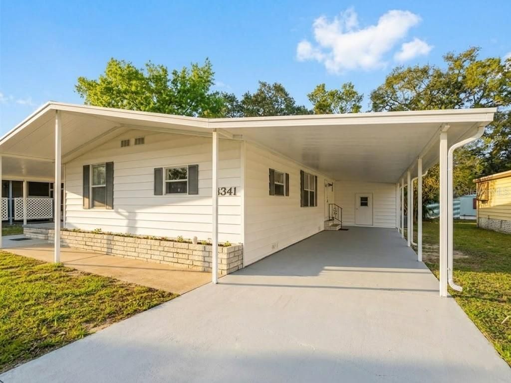 Photo of 8341 Highpoint Boulevard, Brooksville, FL 34613 (MLS # O6392256)